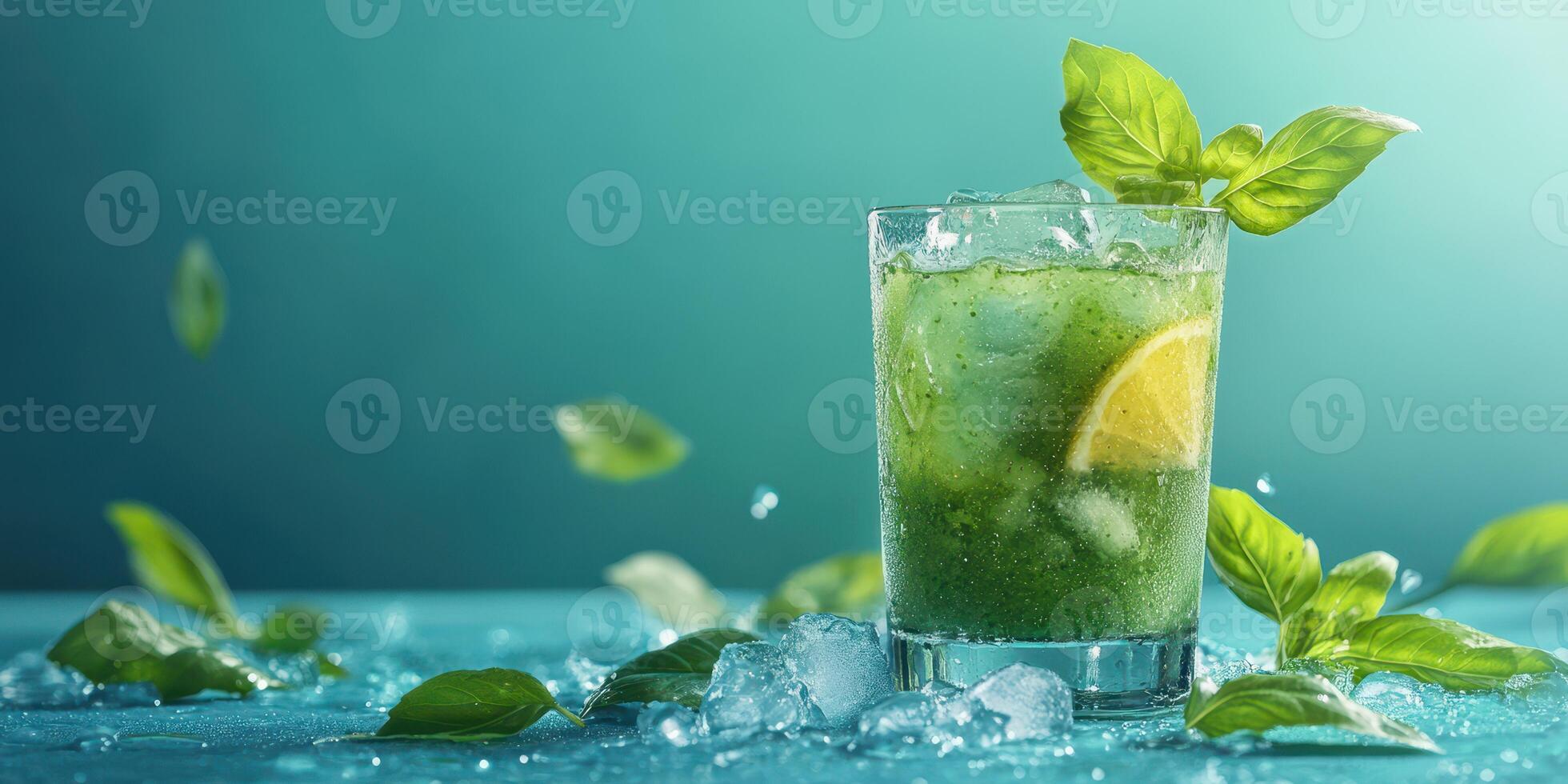 Refreshing basil lemonade drink with ice and lime slices served in a glass photo