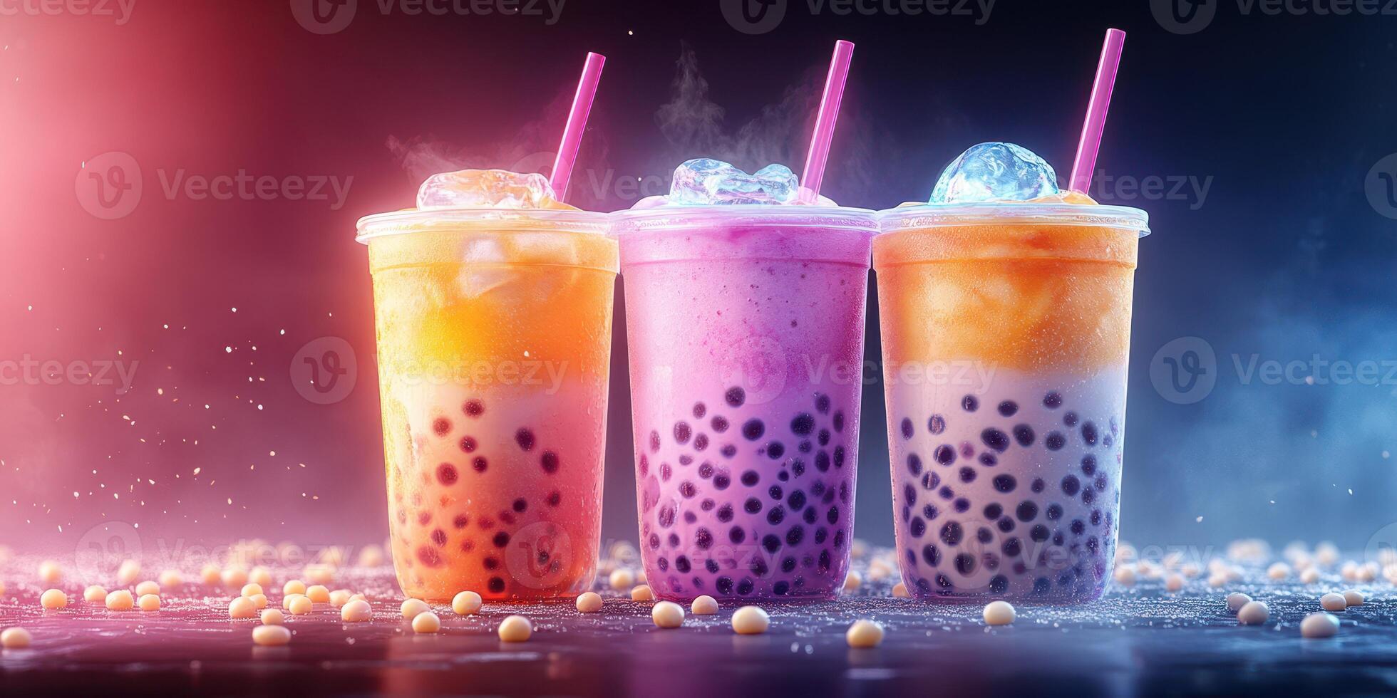 Colorful bubble tea drinks arranged artfully on a surface with vibrant lighting and ice cubes at a trendy cafe during an evening gathering photo