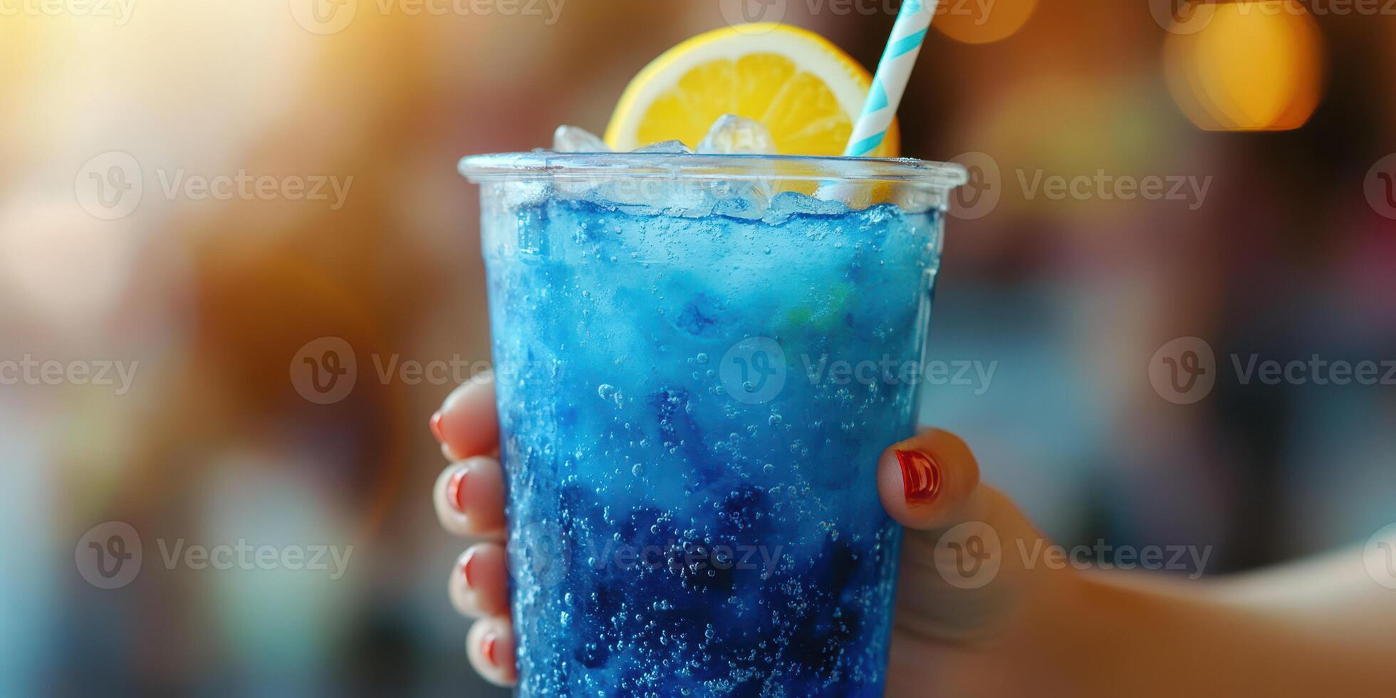 Refreshing blue drink served with a lemon slice in a cozy setting on a sunny afternoon photo