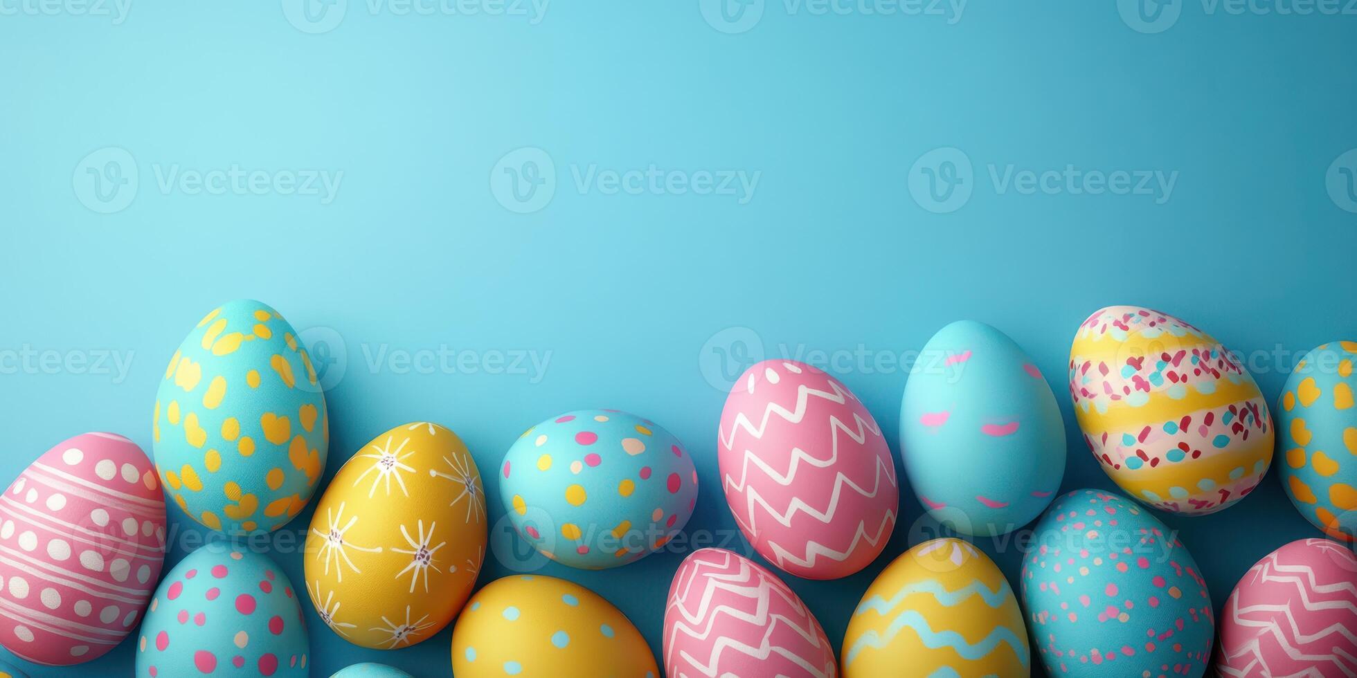Colorful decorated Easter eggs arranged on a bright blue background capturing the festive spirit of springtime celebrations photo