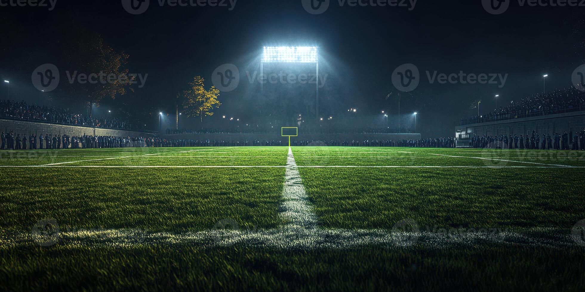 Nighttime football match at a stadium with enthusiastic fans gathered around the field photo