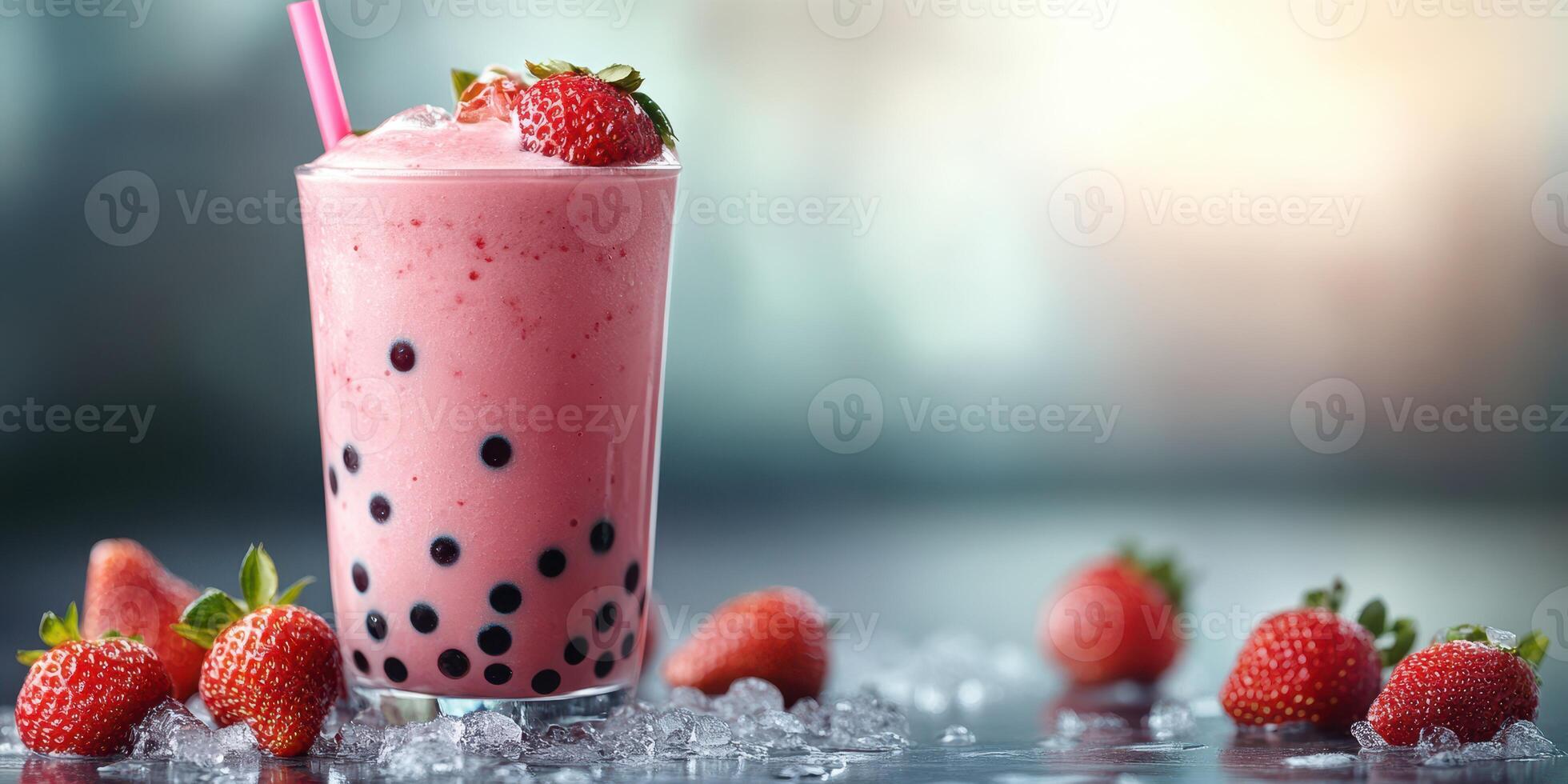 Refreshing strawberry bubble tea served with fresh strawberries and ice on a bright surface in a casual setting photo