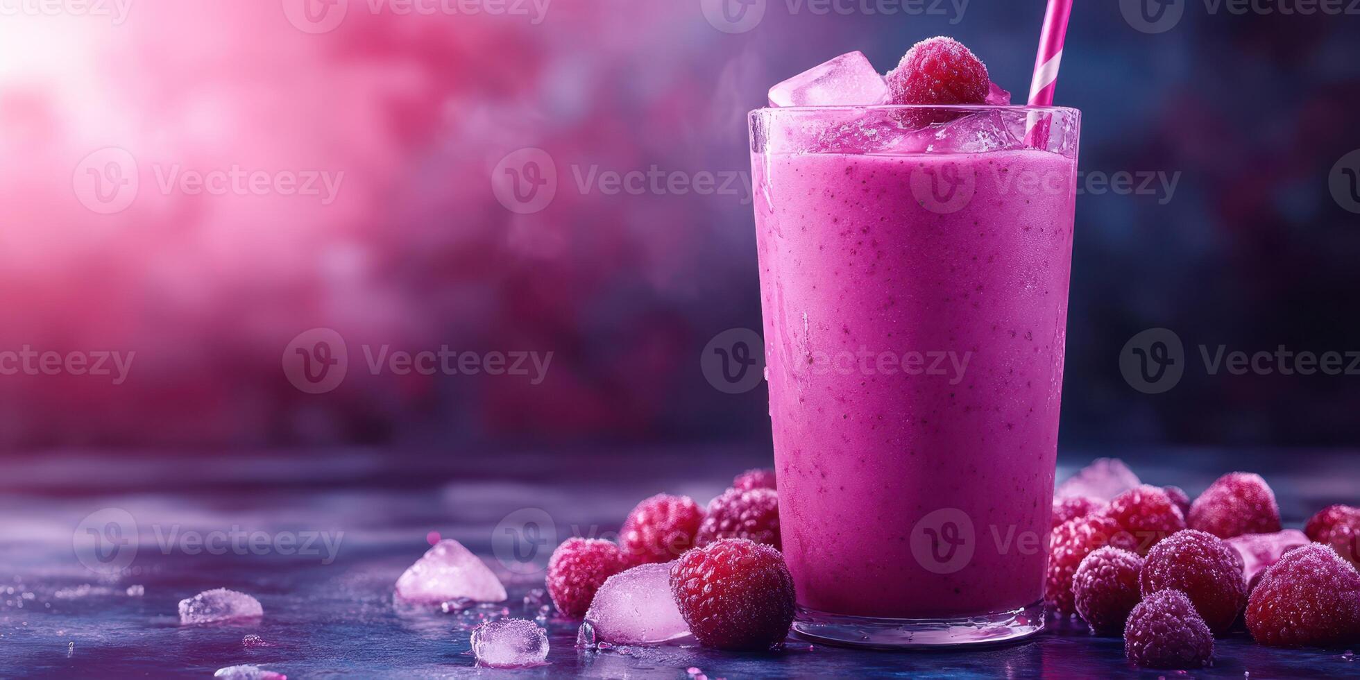 Refreshing raspberry smoothie in a glass with ice and fresh berries on a dark surface photo