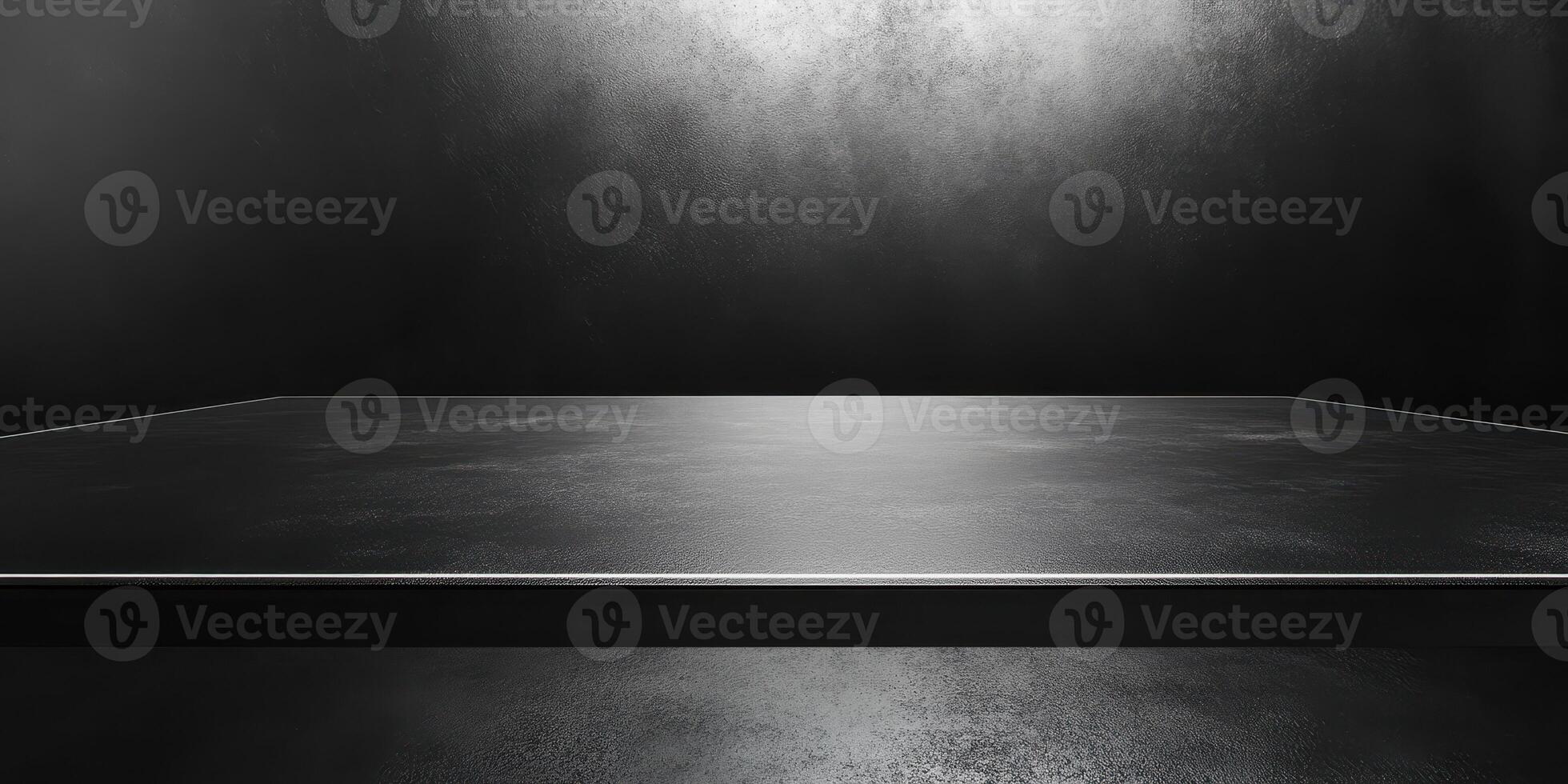 Smooth black surface with dramatic lighting creates a modern and minimalist backdrop for display purposes photo
