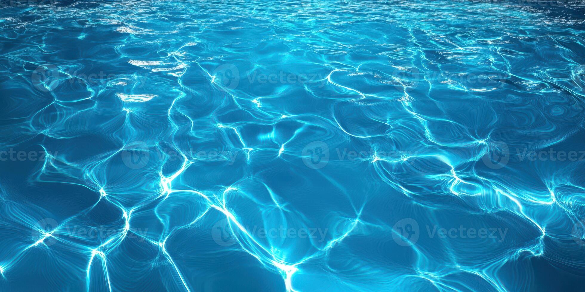 Rippling clear blue water glimmers under sunlight revealing beautiful patterns and reflections in a serene aquatic environment photo