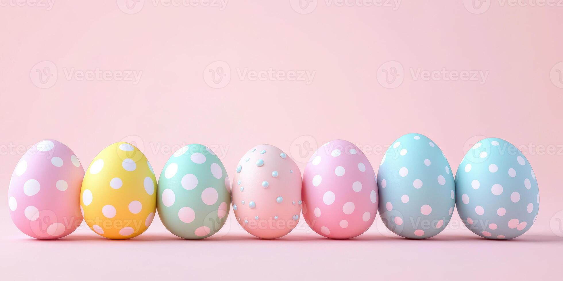 Colorful polka dot easter eggs arranged in a row against a pastel pink background photo
