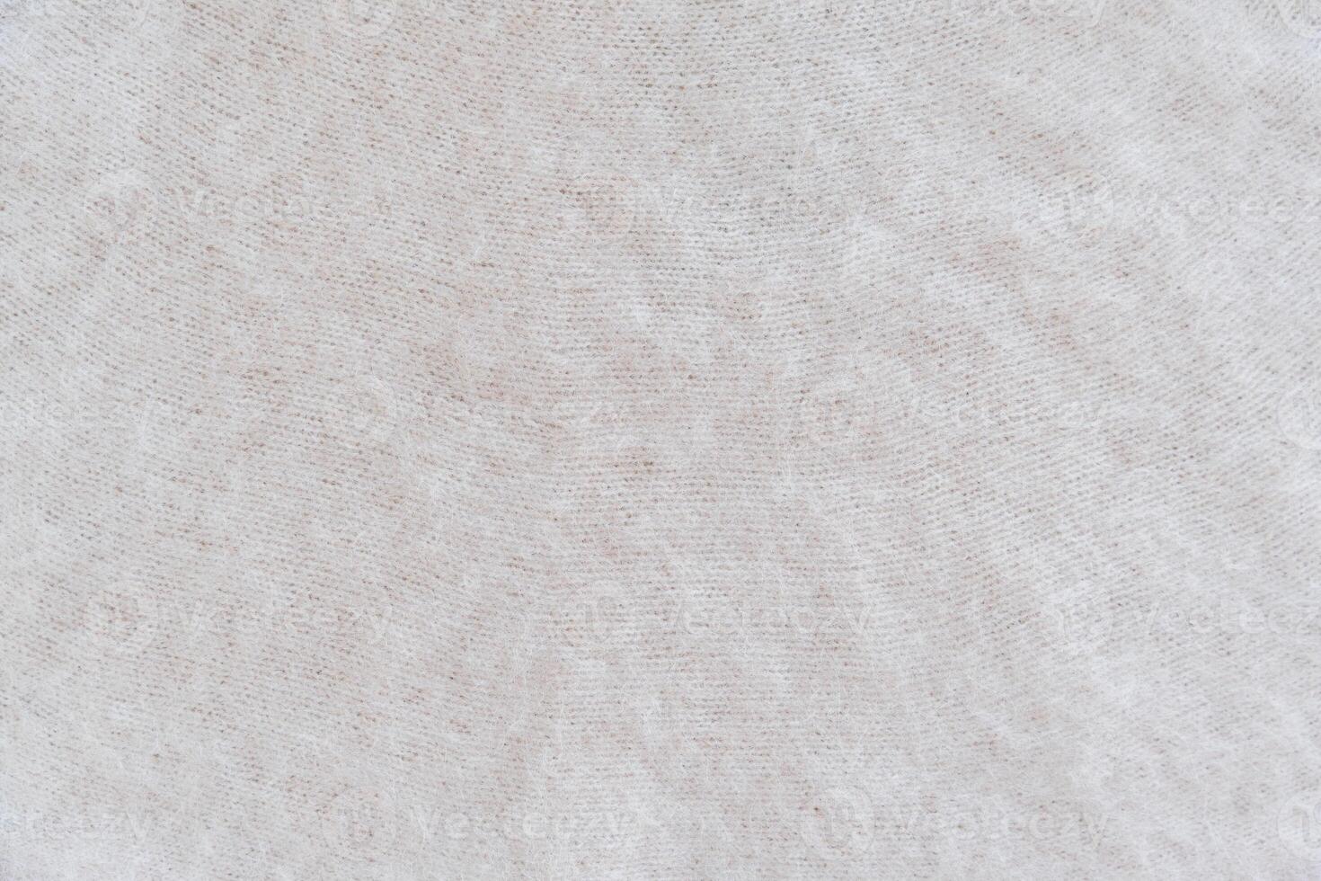 Close-up of soft white mohair fabric with delicate fibers and fluffy textured photo