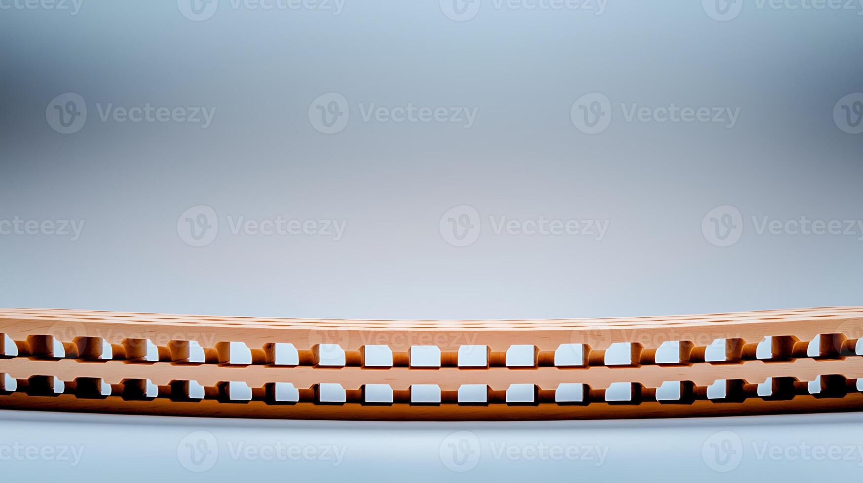 Close-up view of a wooden harmonica resting on a smooth gradient background, showcasing craftsmanship photo