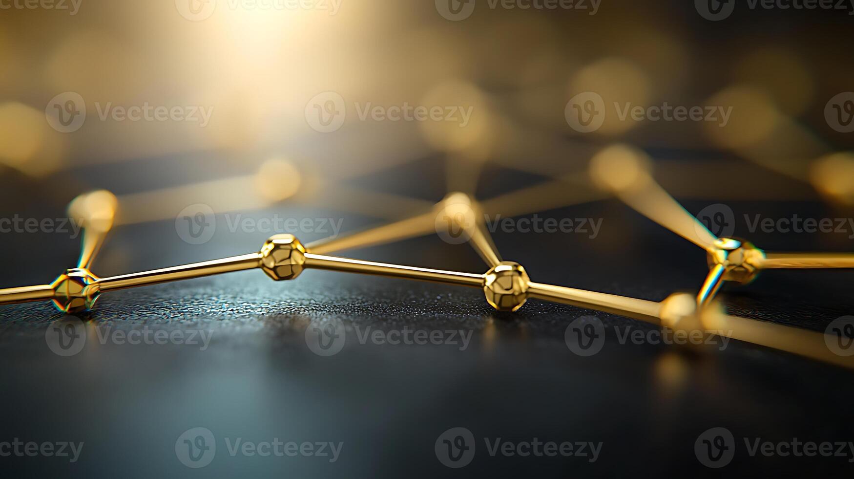 Close-up view of interconnected golden nodes on a dark surface, symbolizing technology and connection photo