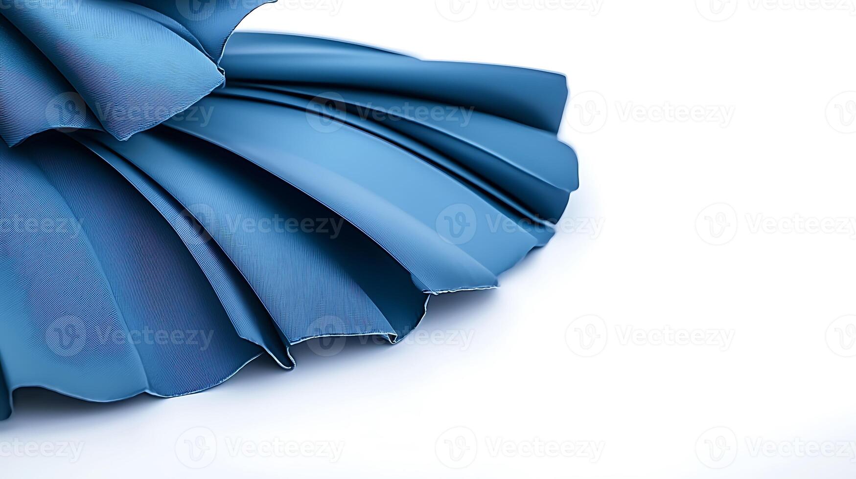 Close-up view of layered blue fabric folds showcasing texture and color against a white background photo