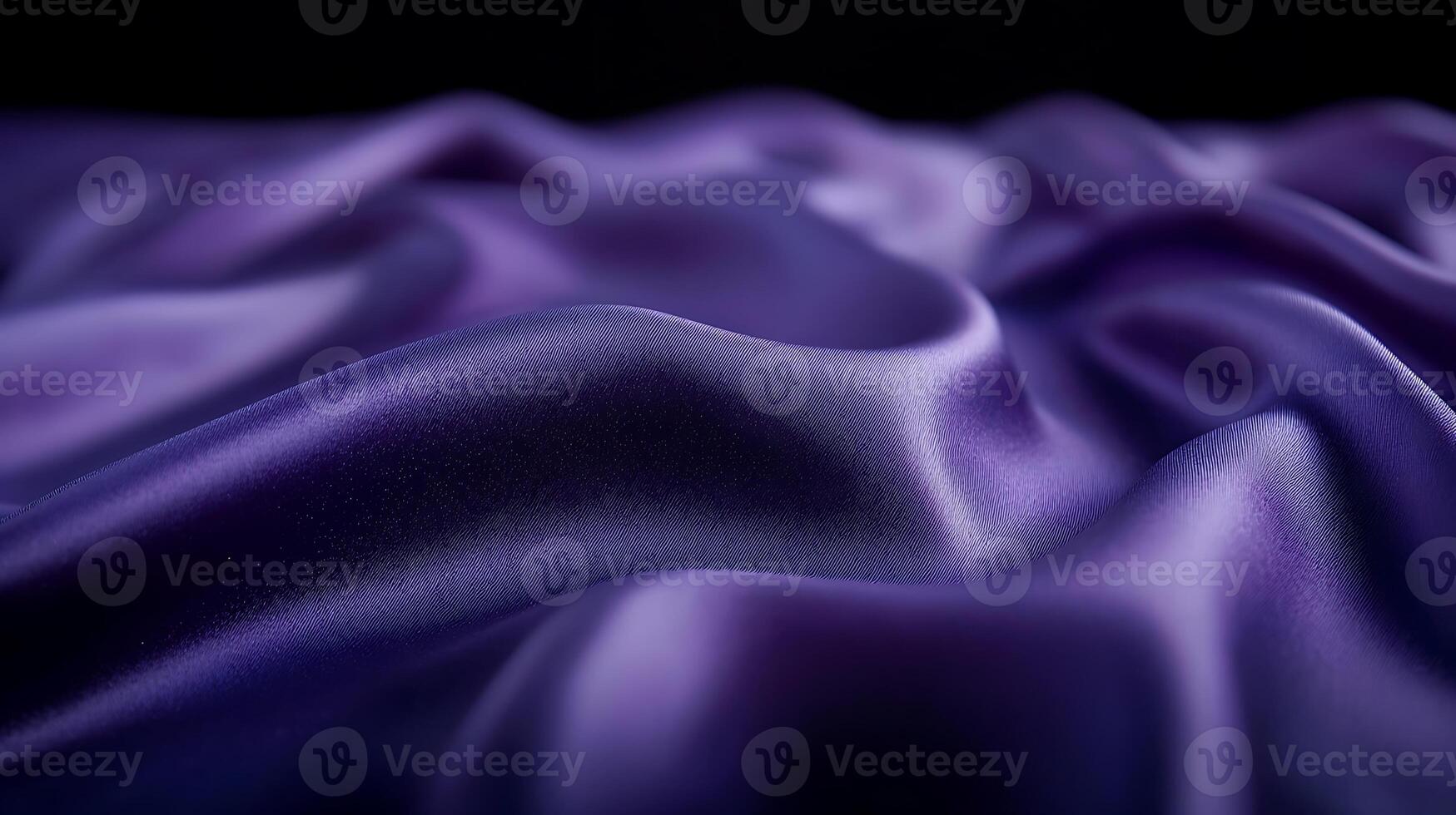Close-up view of luxurious purple satin fabric with soft folds and gentle sheen, ideal for design photo