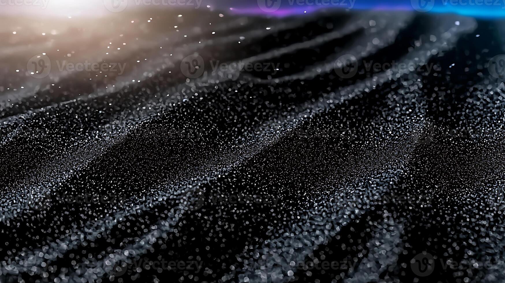 Close-up view of shimmering black sand dunes under soft lighting with a dreamy atmosphere photo