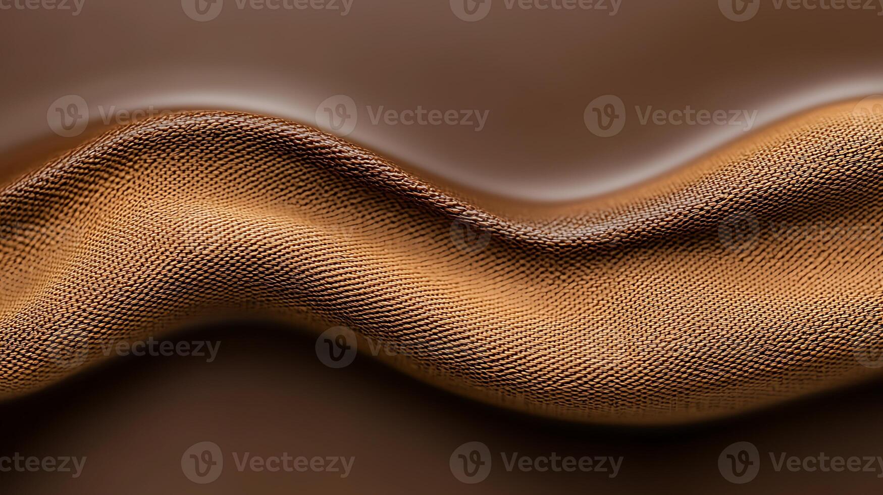Close-up view of smooth, wavy brown fabric with a rich texture and sheen, ideal for fashion design photo