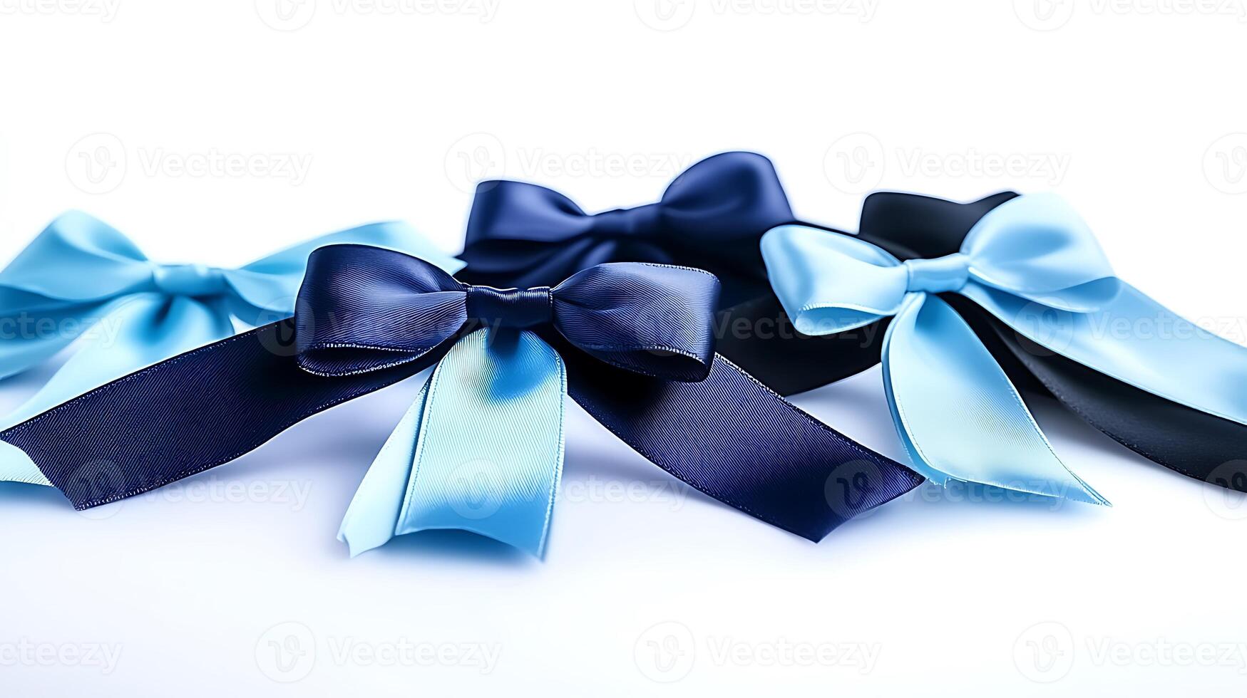 Collection of elegant satin bows in various shades of blue and black on a white background photo