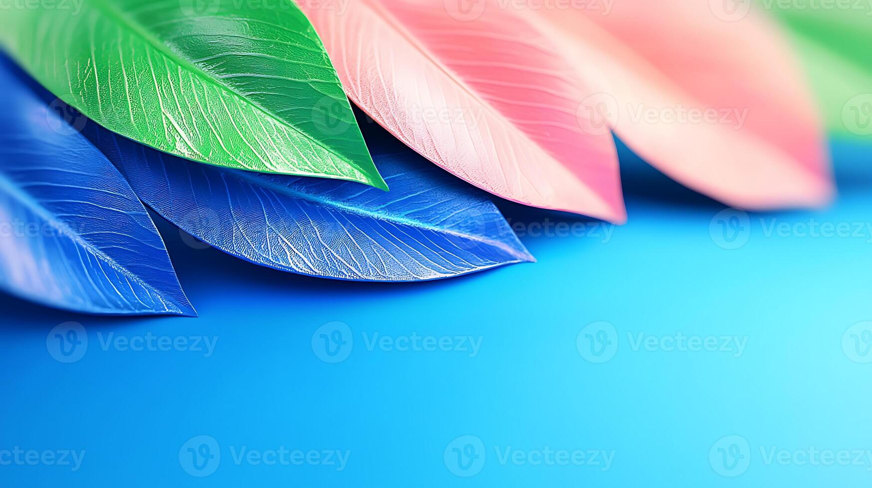 Colorful artificial leaves arranged in a vibrant gradient against a blue background photo