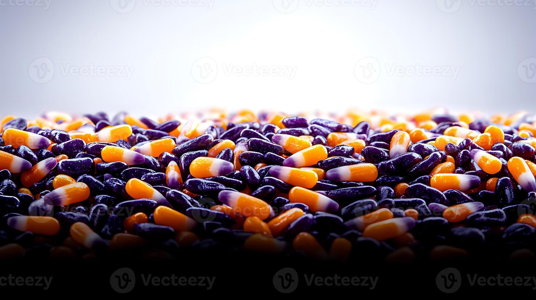 Colorful assortment of vibrant capsules scattered on a smooth surface, creating a visually appealing backdrop photo