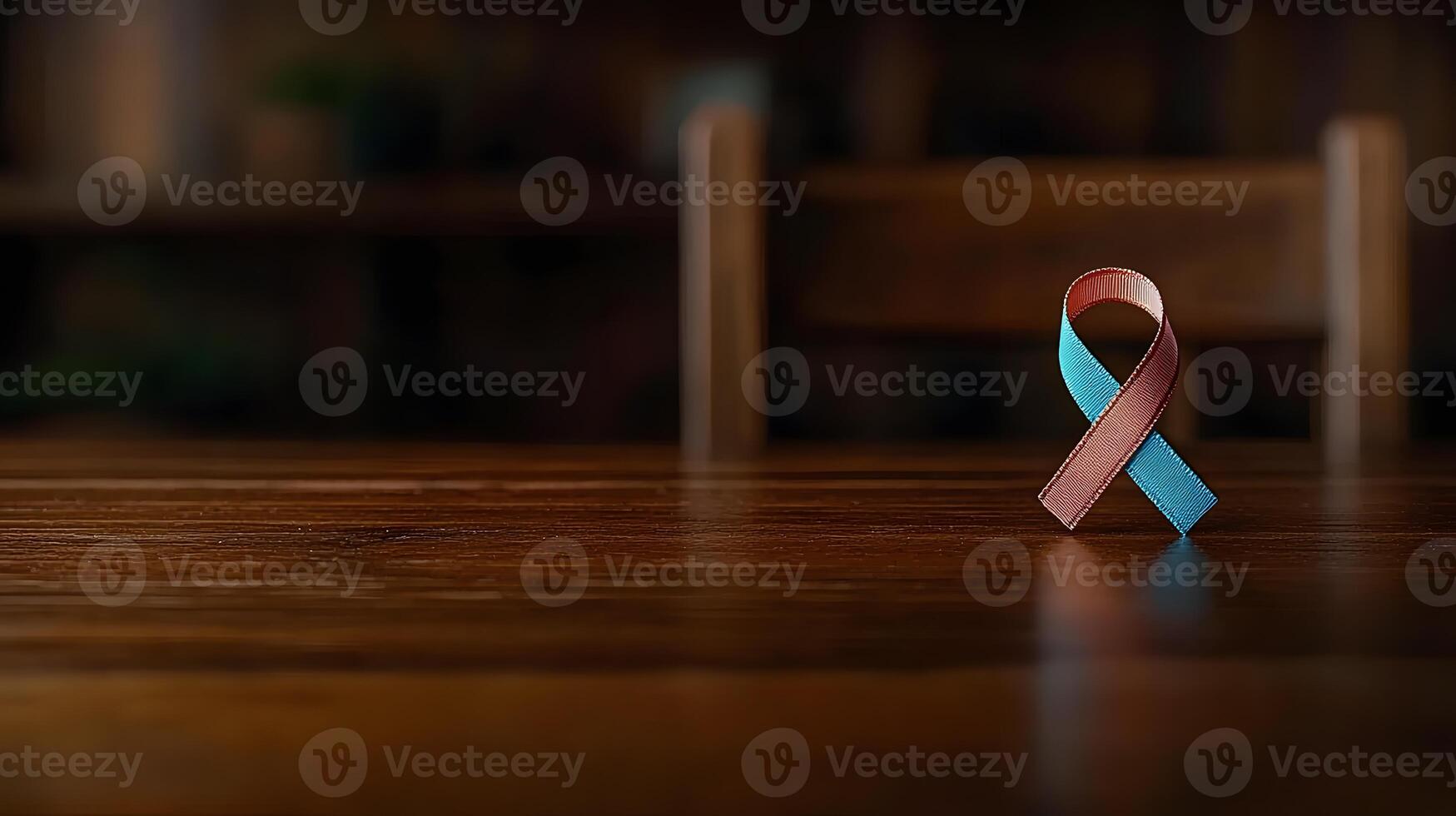 Colorful awareness ribbon placed on a wooden table in a cozy indoor setting with blurred background photo