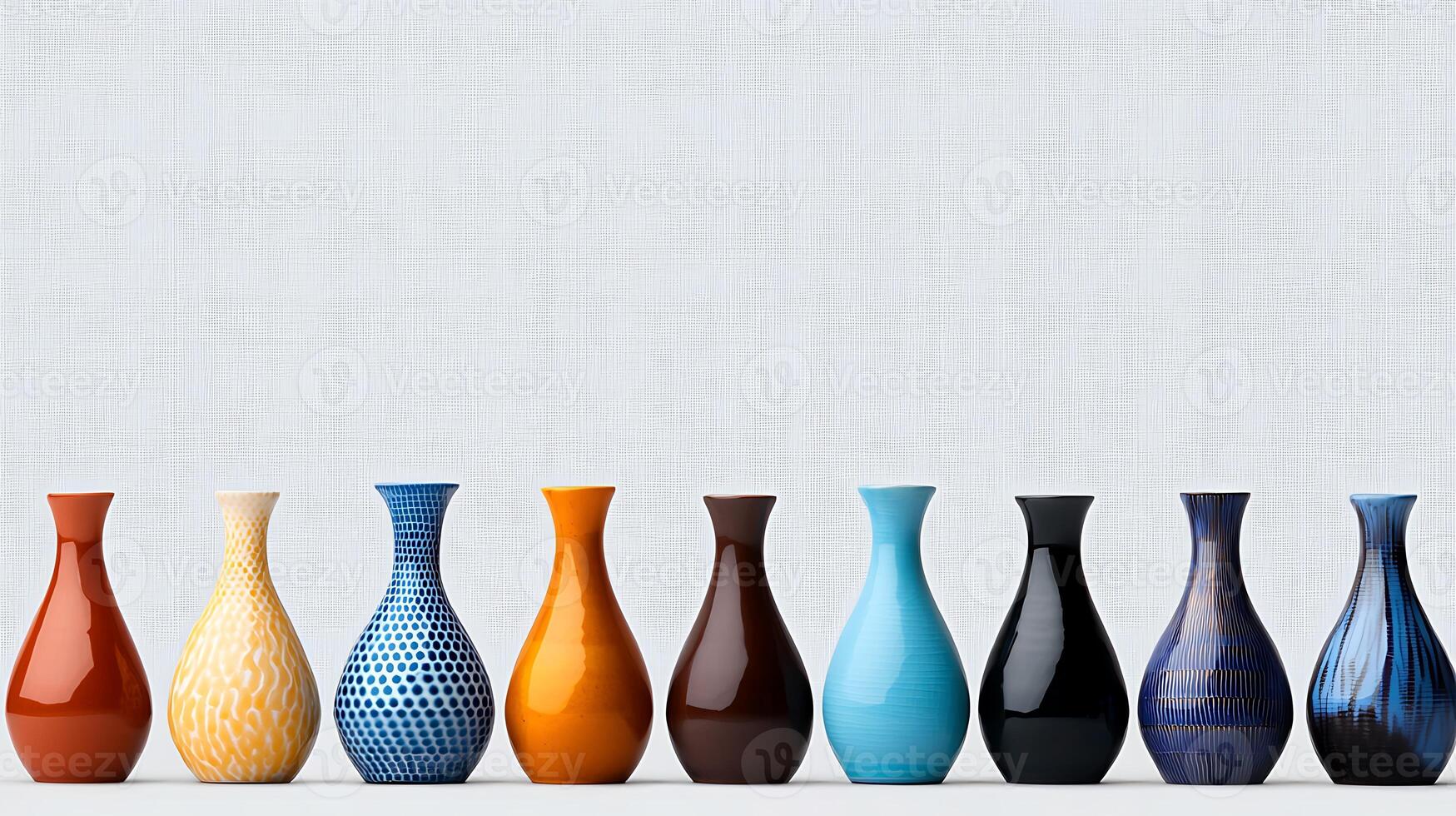 Colorful ceramic vases arranged in a row against a textured background, showcasing design diversity photo
