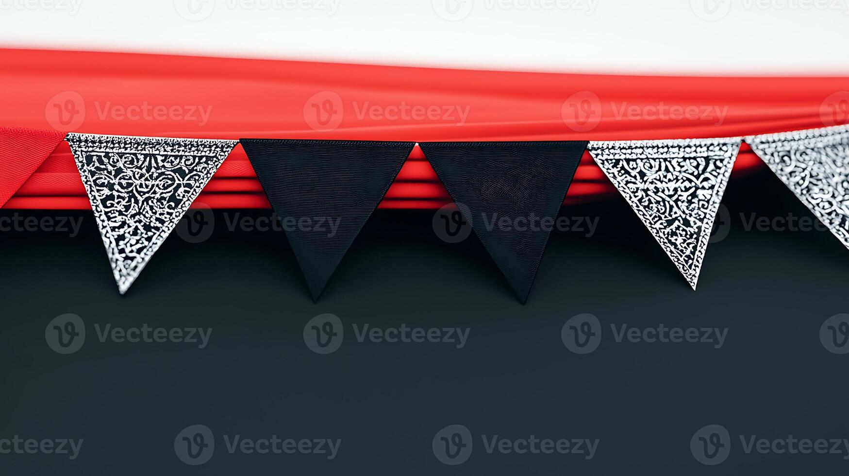 Colorful decorative bunting with black and silver flags against a vibrant red backdrop photo