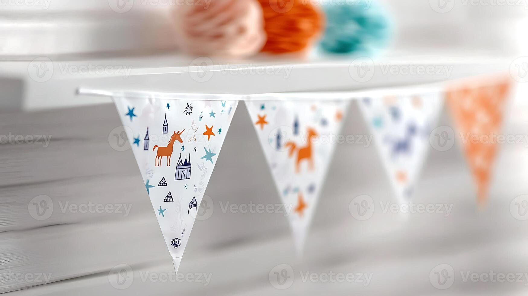 Colorful decorative bunting with unicorns and stars hanging on a shelf in a bright room photo