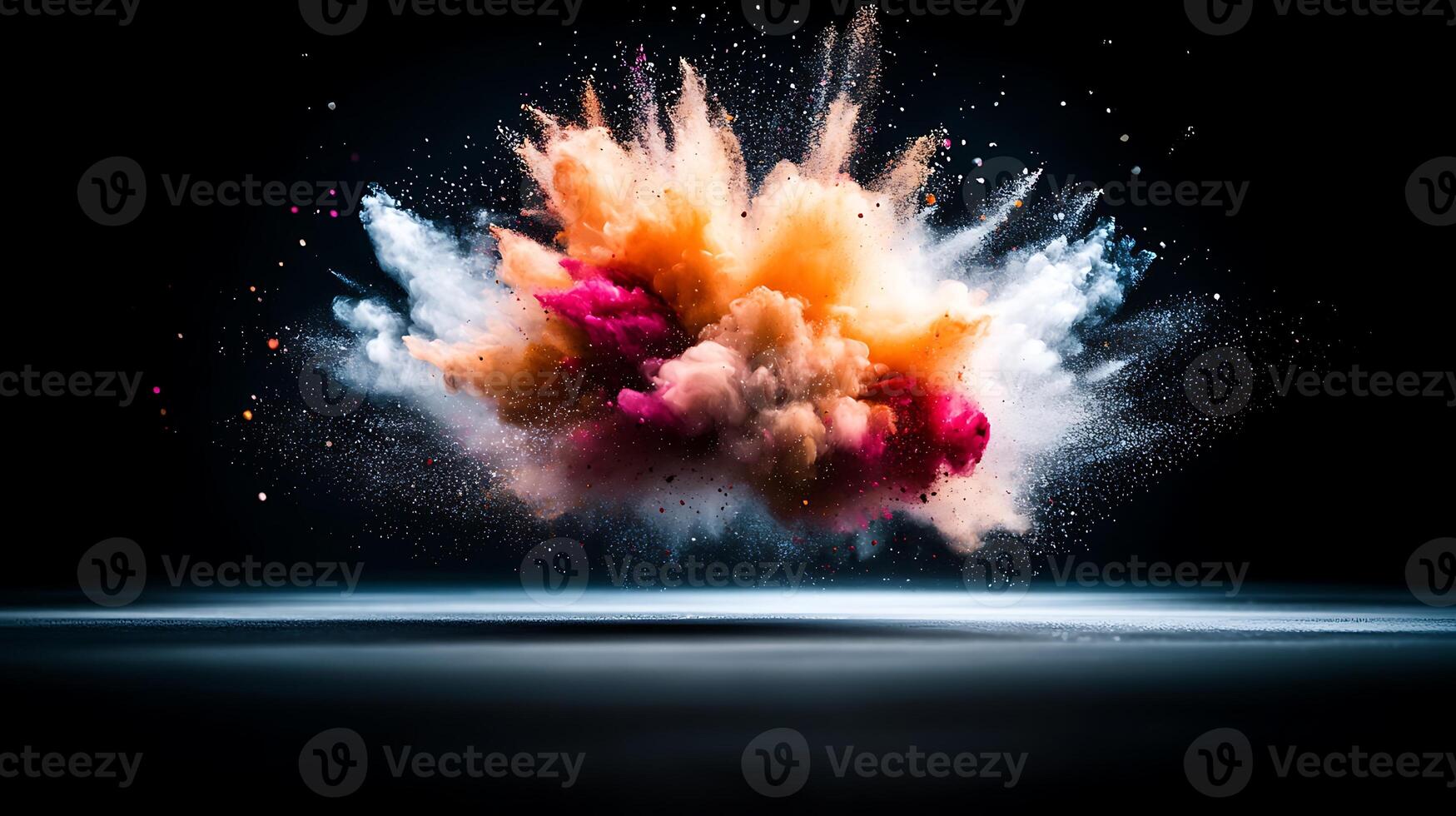 Colorful explosion of powder creating a dynamic visual effect against a dark background photo