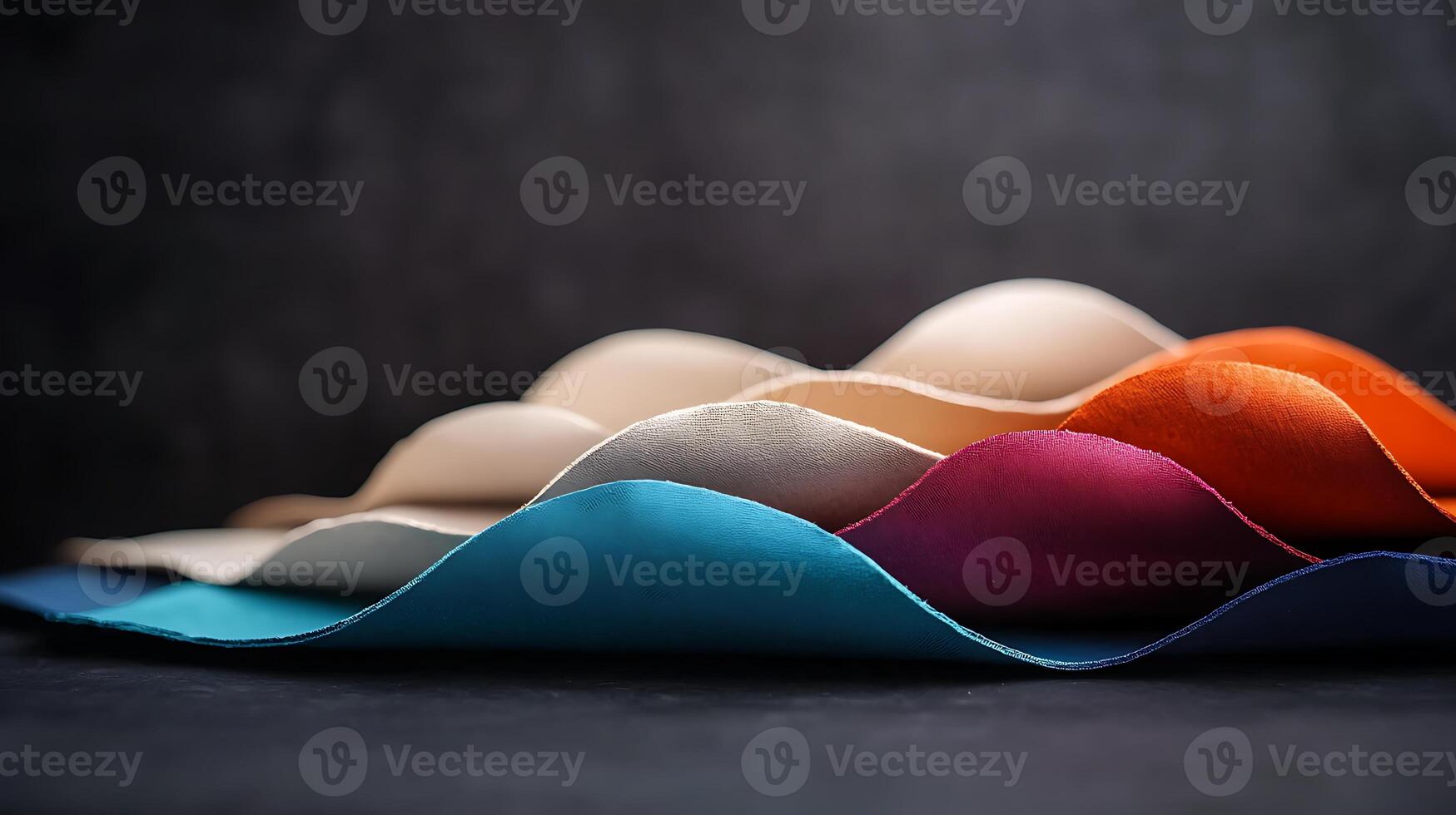 Colorful fabric waves showcasing textures in a studio setting with soft lighting effects photo