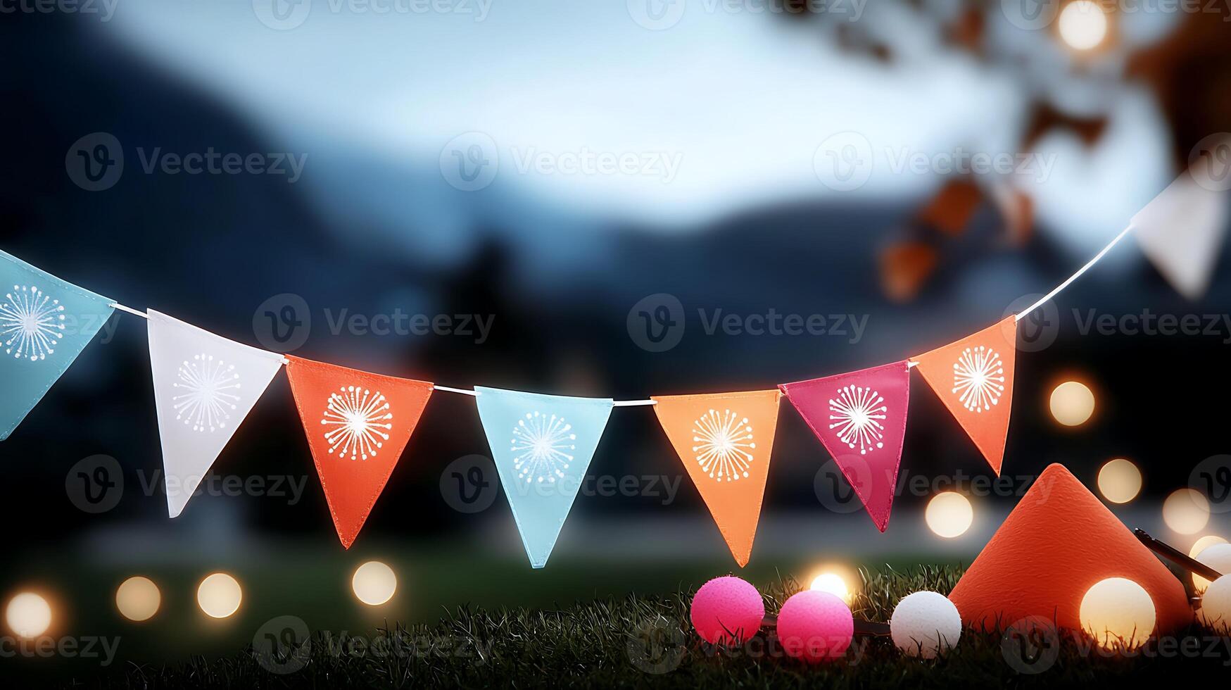 Colorful festive decorations with bunting and glowing orbs set against a serene twilight backdrop photo