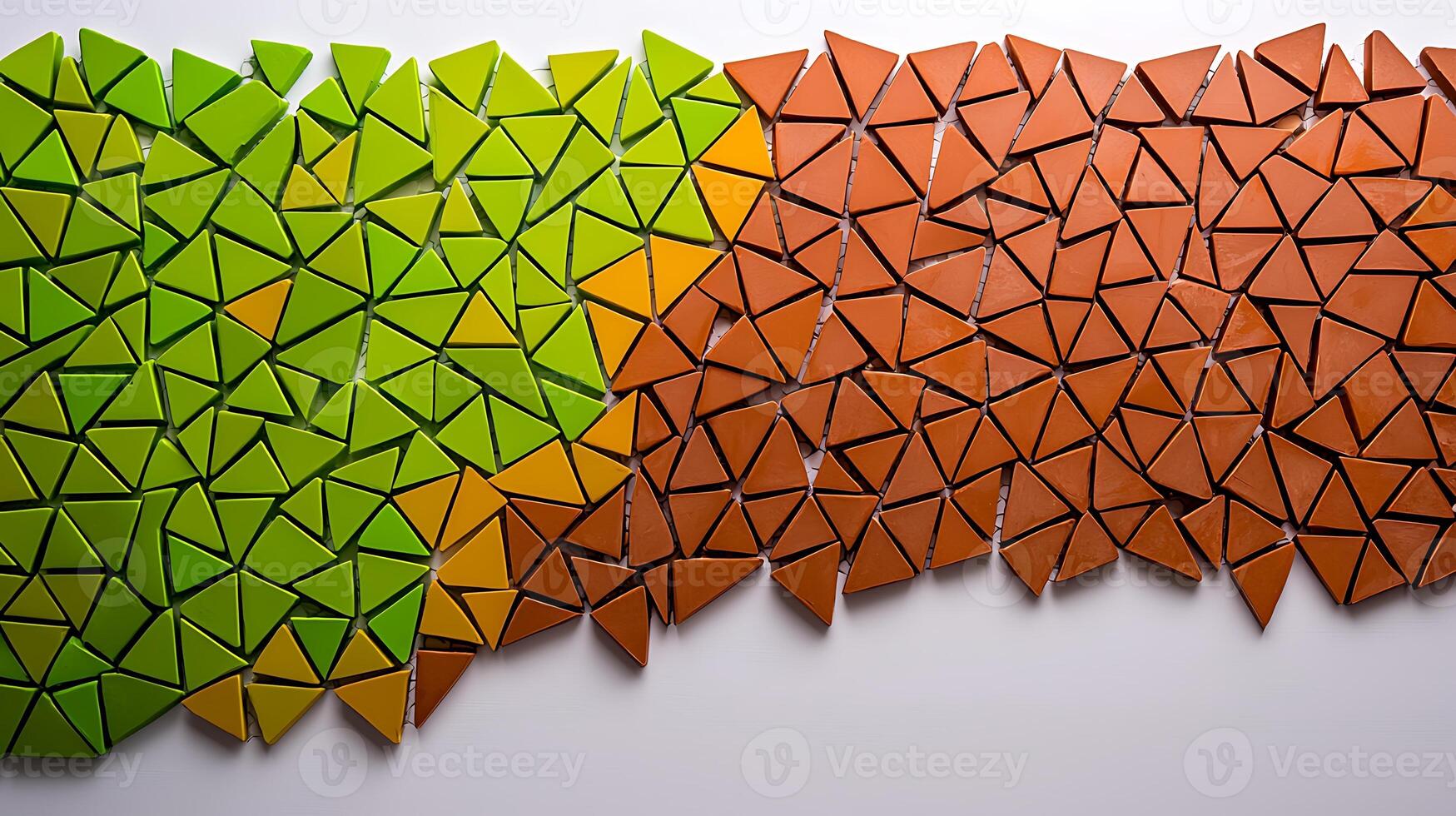 Colorful geometric mosaic of green and orange triangular pieces arranged artistically photo