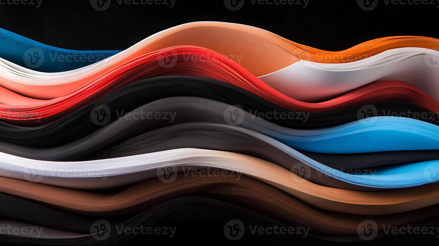 Colorful layers of textured paper waves creating an abstract design against a dark background photo