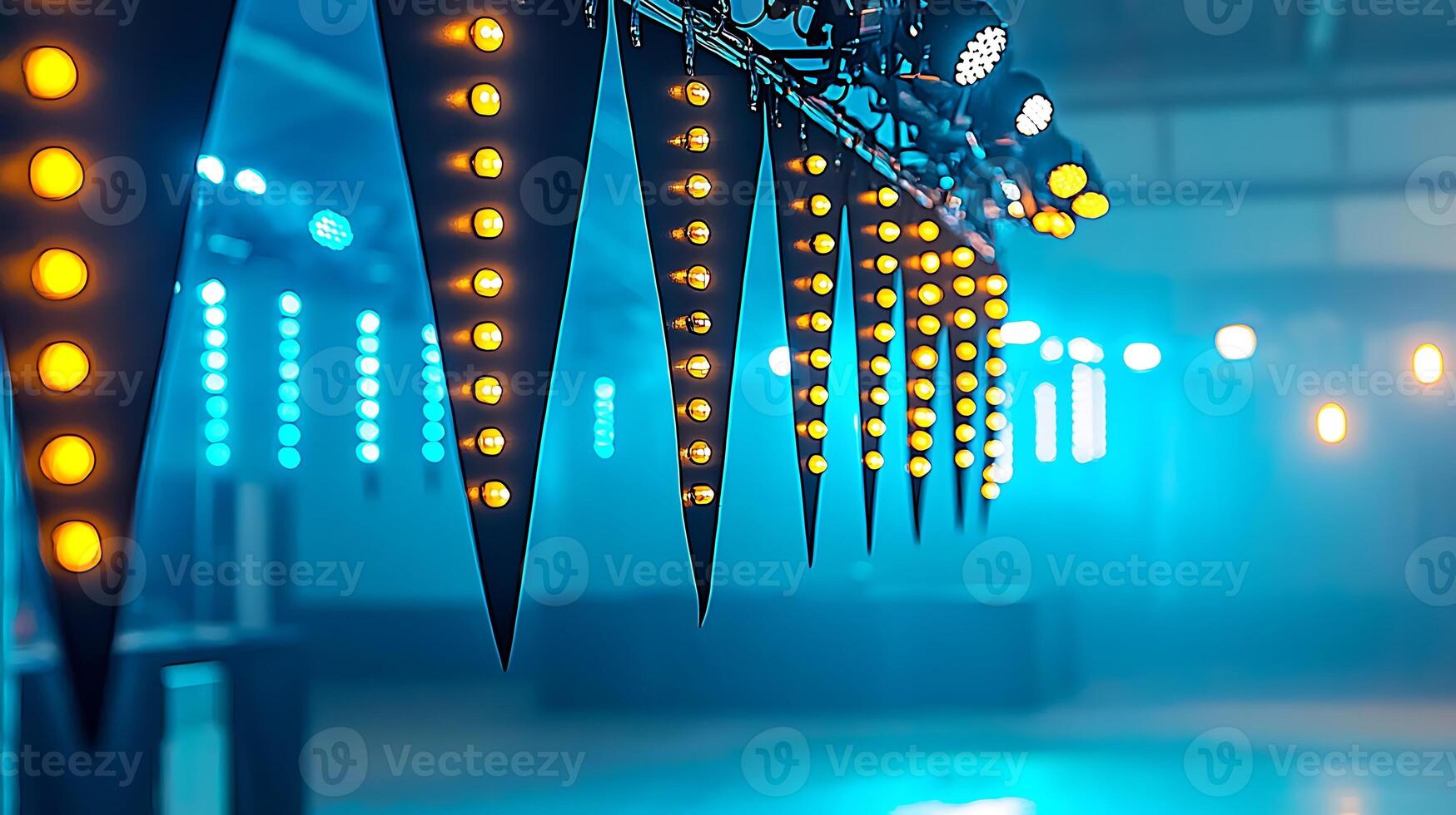 Colorful lights and banners create a vibrant atmosphere in an empty event space photo