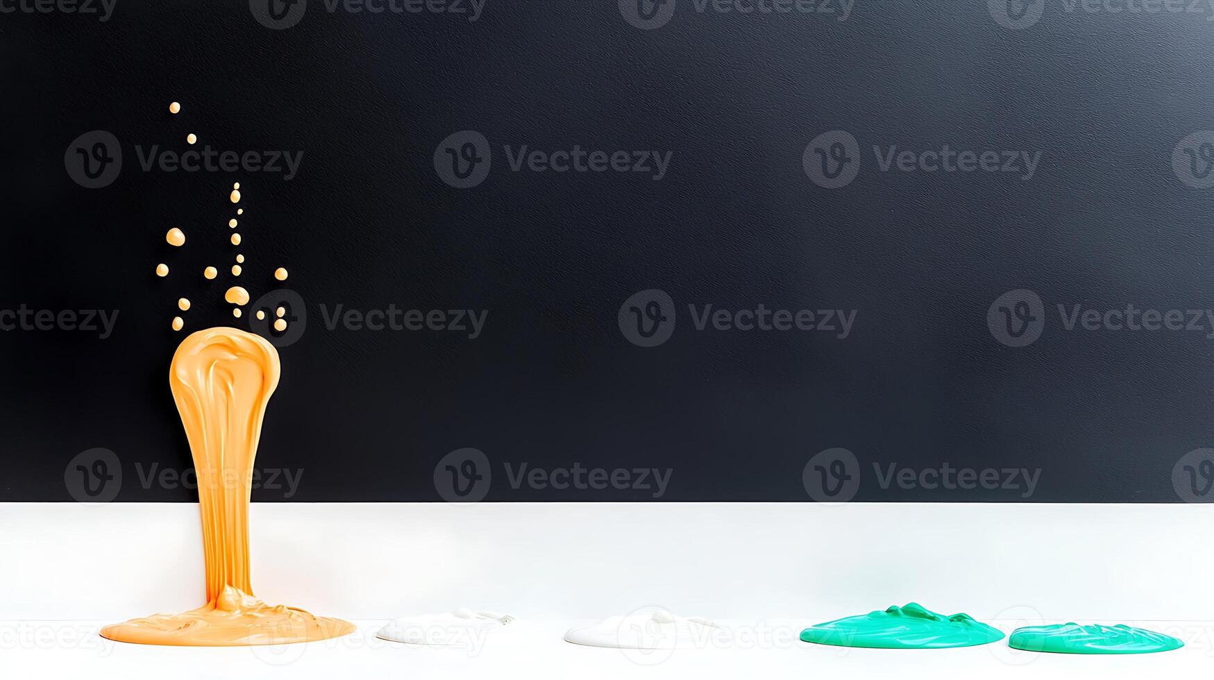 Colorful paint splashes against a dark wall, showcasing artistic creativity in a studio setting photo