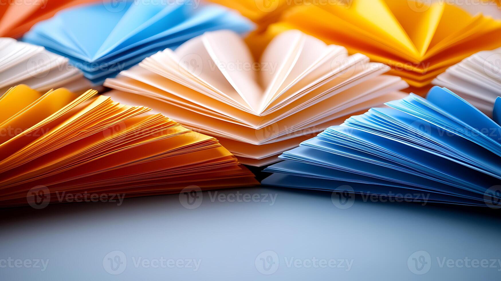 Colorful paper fans arranged in a vibrant pattern on a smooth surface, showcasing creativity photo