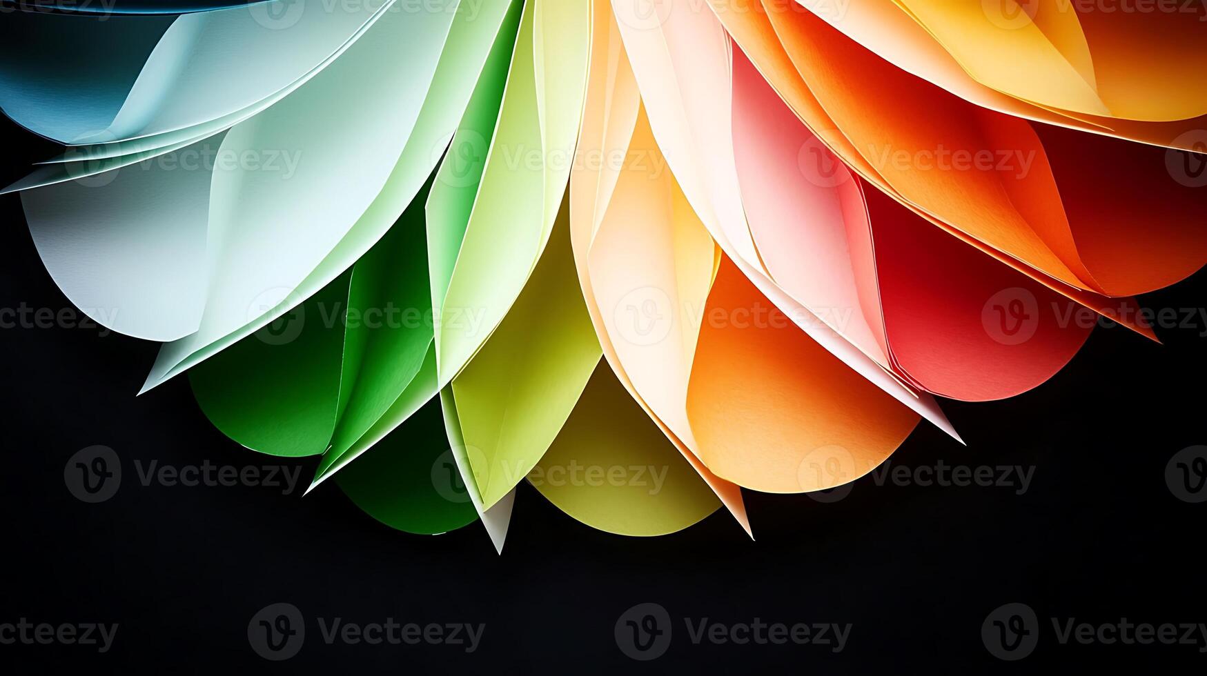 Colorful paper sheets arranged in a circular pattern on a dark background, showcasing vibrant hues photo