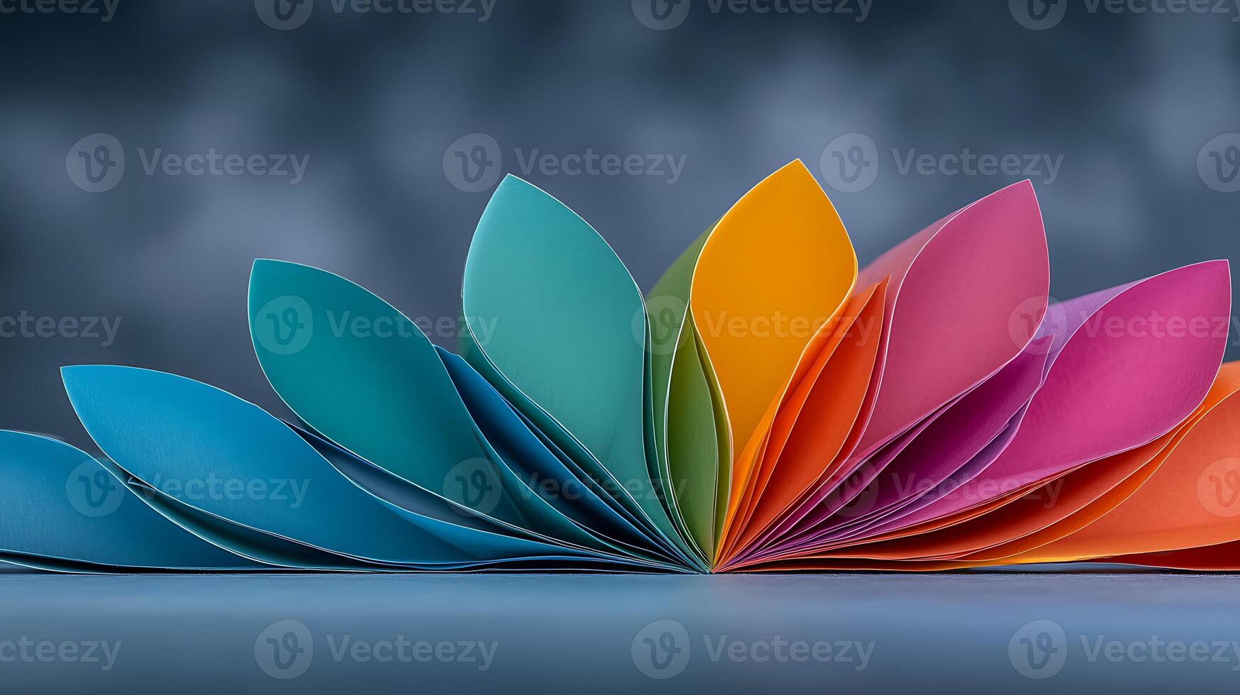 Colorful paper petals arranged in a wave pattern against a blurred background, showcasing creativity photo