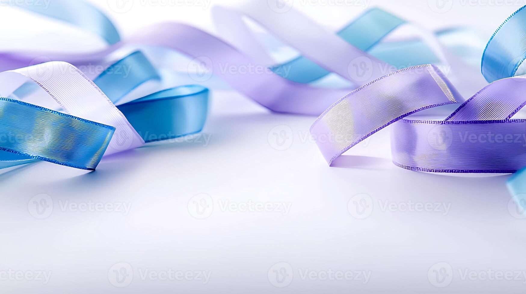 Colorful satin ribbons in blue and purple elegantly arranged on a soft white background photo