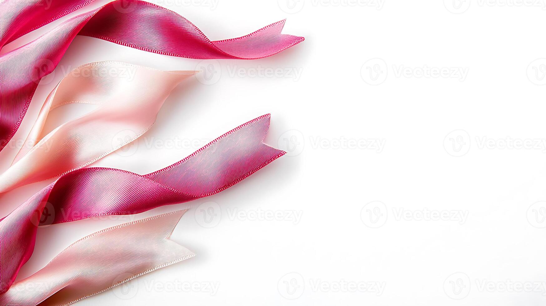 Colorful satin ribbons in shades of pink elegantly arranged on a white background for creative projects photo
