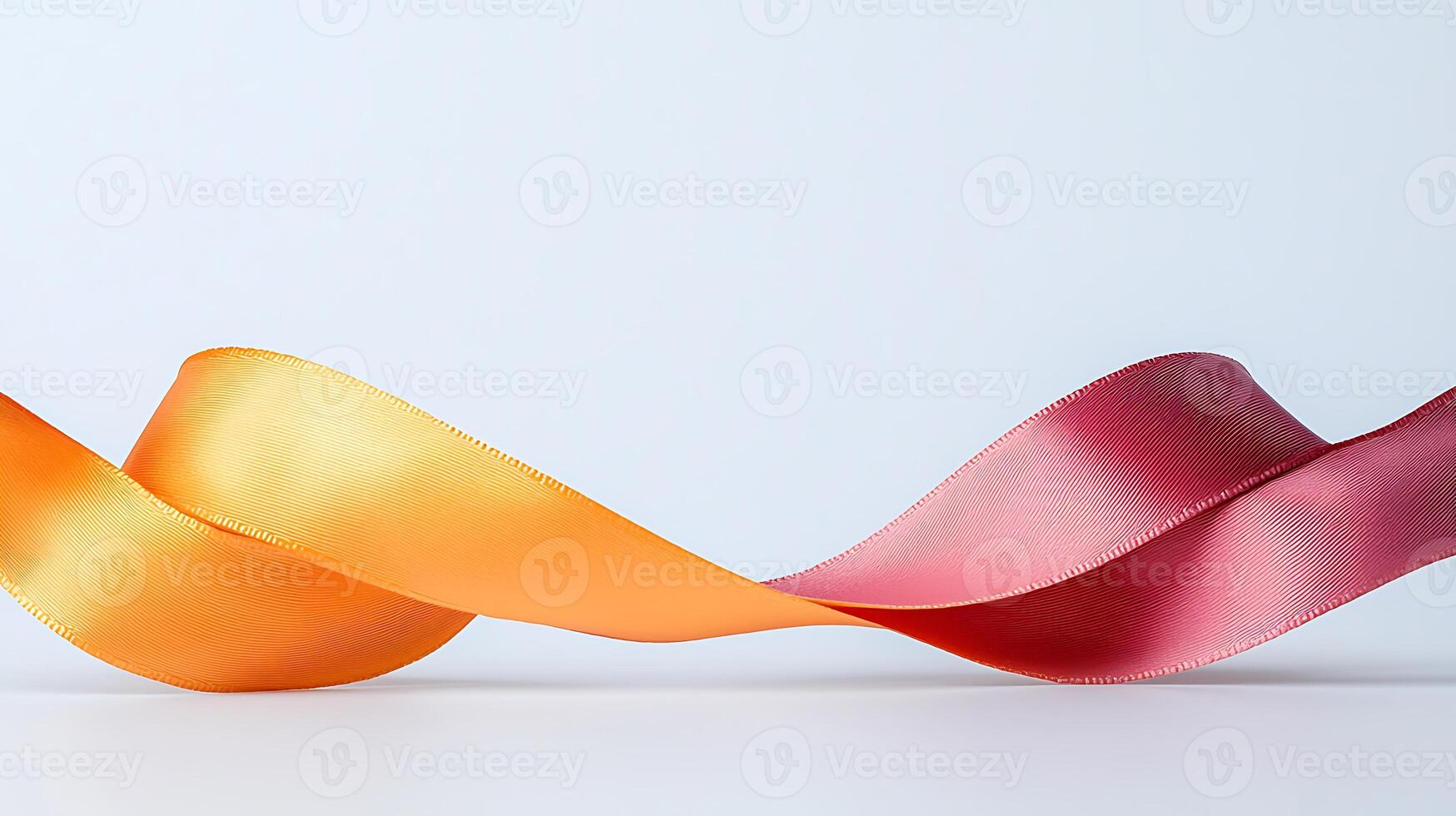 Colorful satin ribbons of orange and maroon elegantly flowing across a minimalist background photo