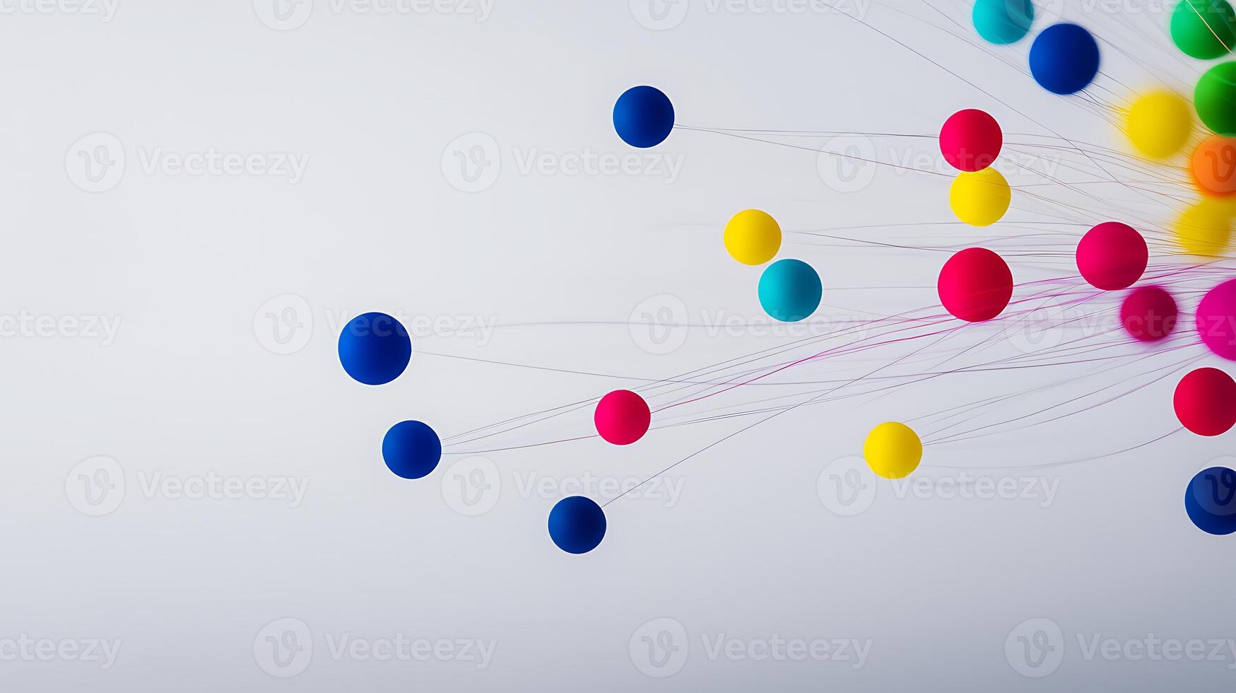 Colorful spheres and strands on a minimalist background, creating a dynamic visual effect photo