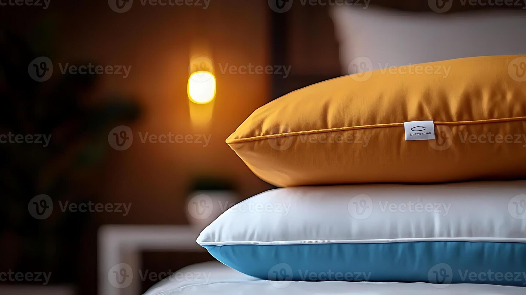 Cozy bedroom scene featuring stacked pillows in vibrant colors with a warm light ambiance photo