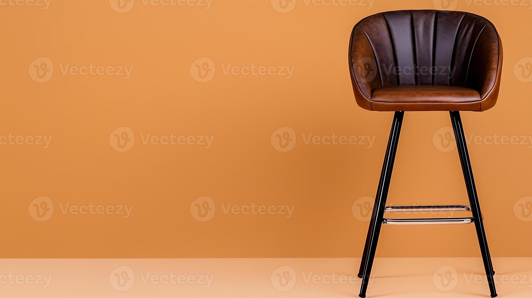 Stylish brown bar stool against a warm orange wall, perfect for modern interior design projects photo