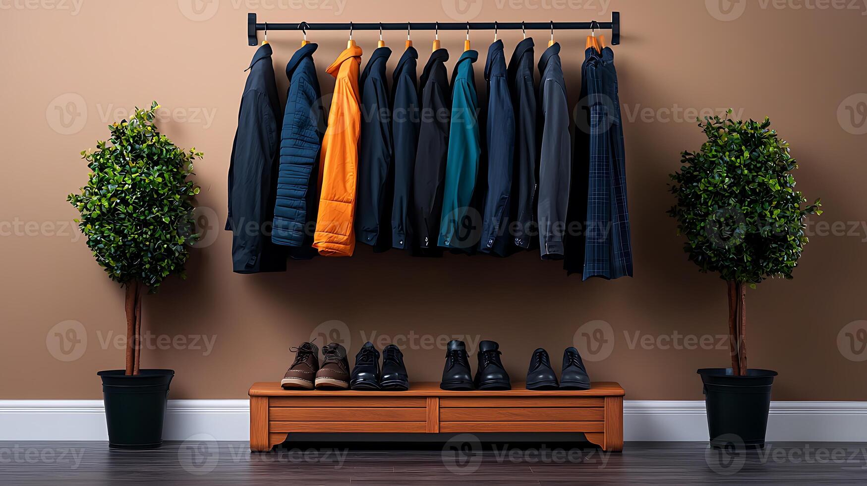 Stylish clothing display with various jackets on a rack, complemented by potted plants and footwear photo