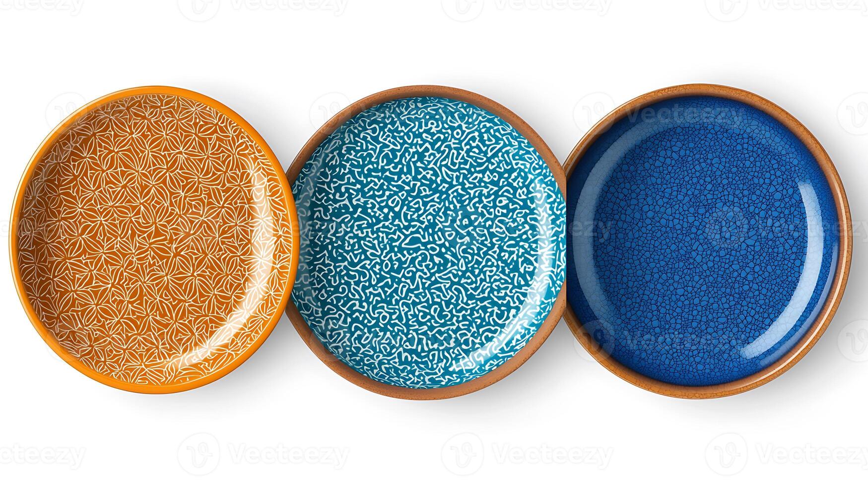 Three decorative ceramic plates in vibrant colors arranged in a row on a white background photo