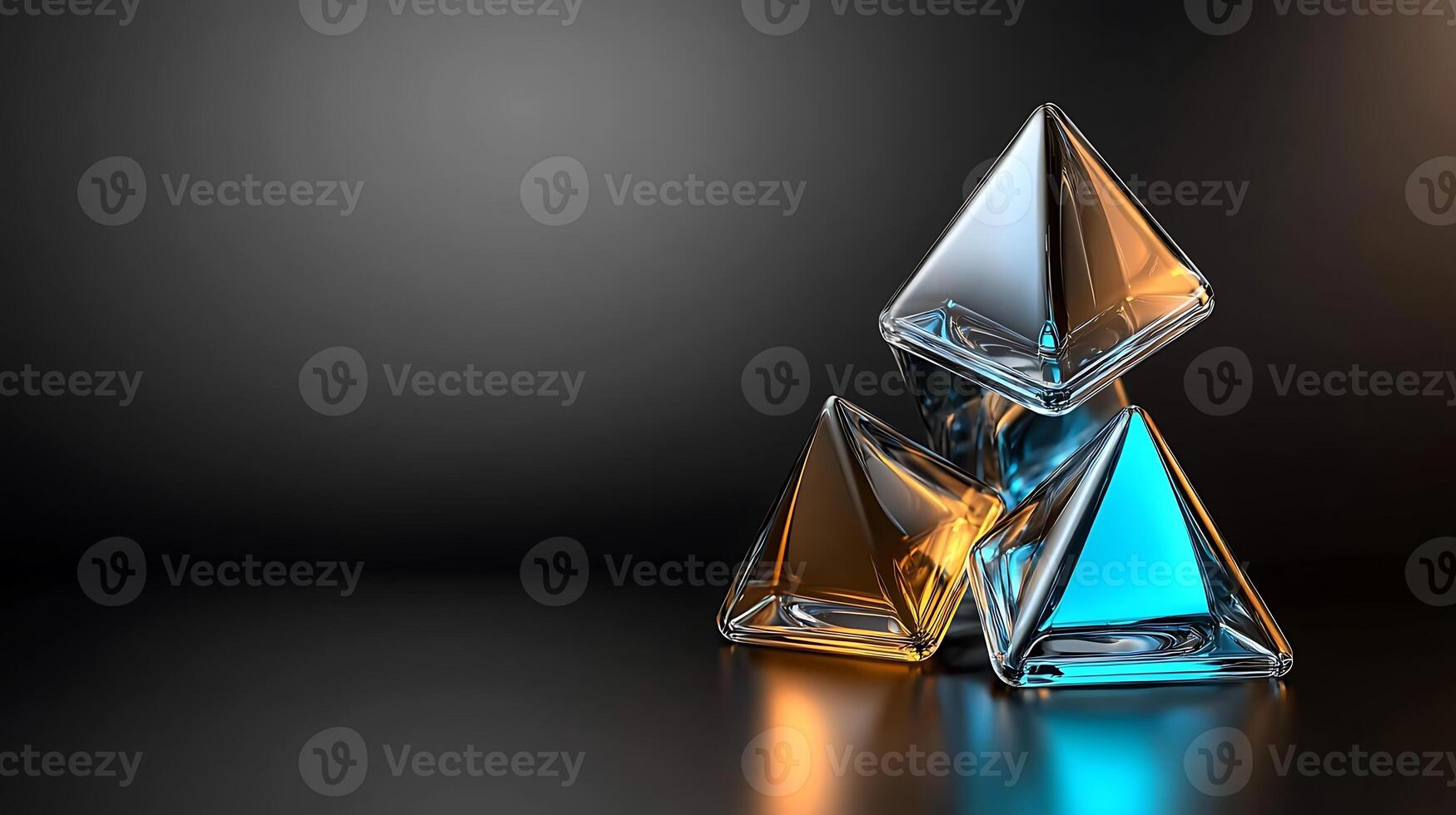 Three glass pyramids in amber and blue hues arranged artistically on a reflective surface photo
