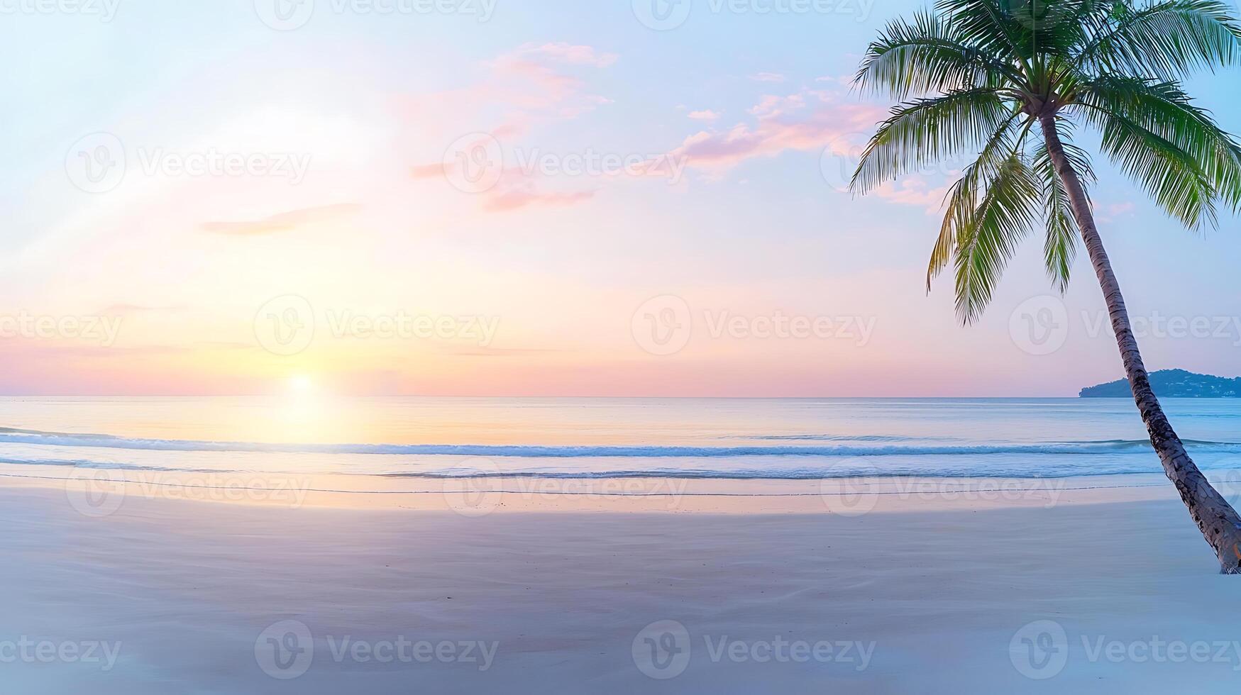 Tranquil beach at sunset with palm tree silhouetted against a colorful sky and calm waves photo