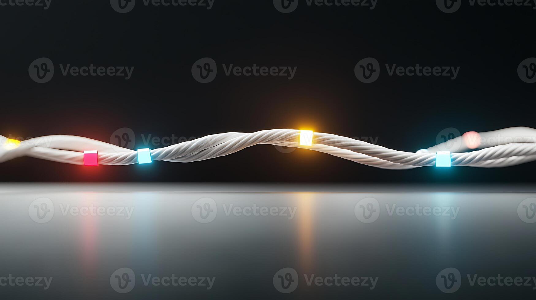 Twisted string lights glowing in vibrant colors, casting reflections on a smooth surface photo