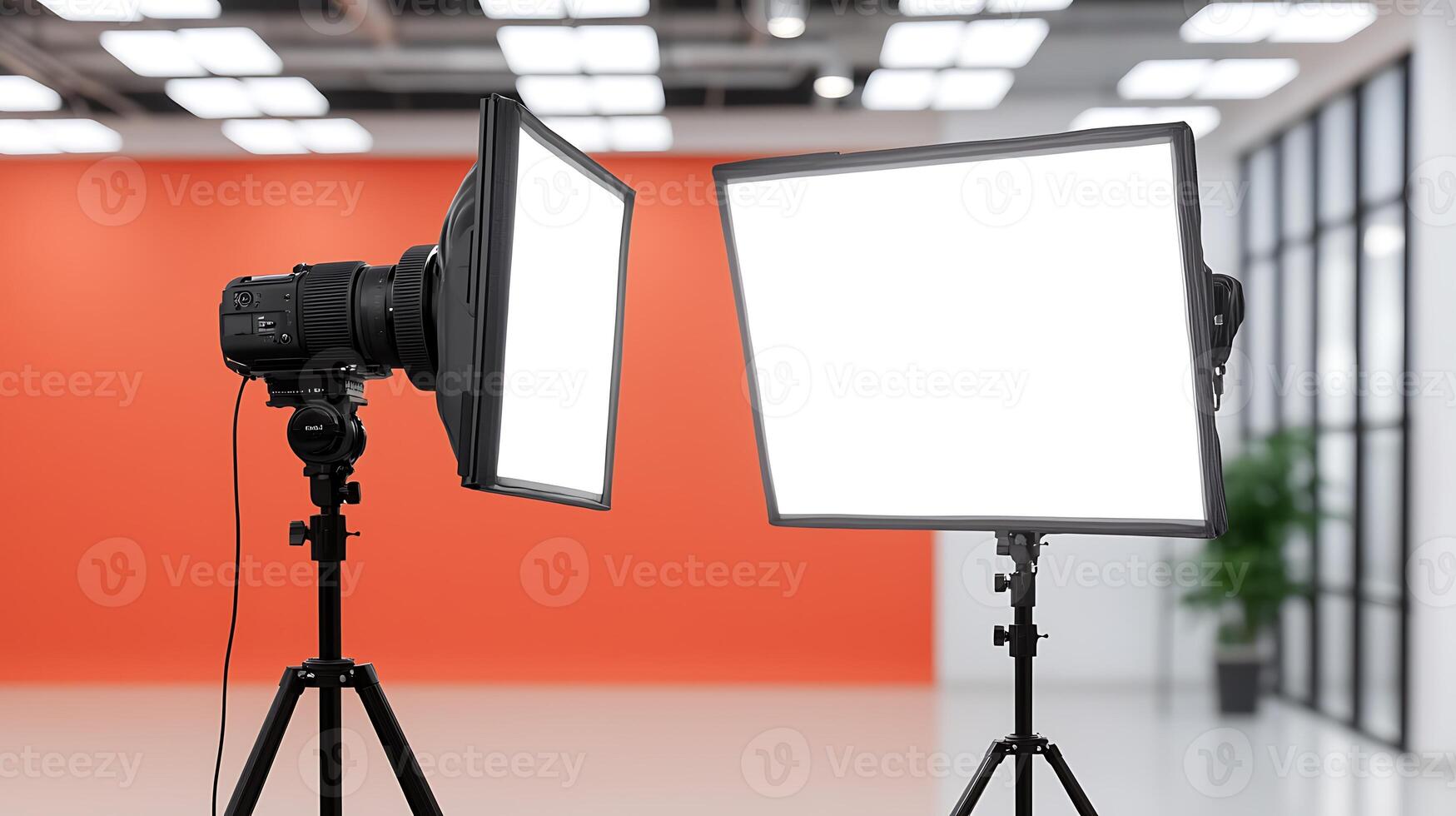 Two professional photography lights set up in a studio with an orange backdrop and modern design photo