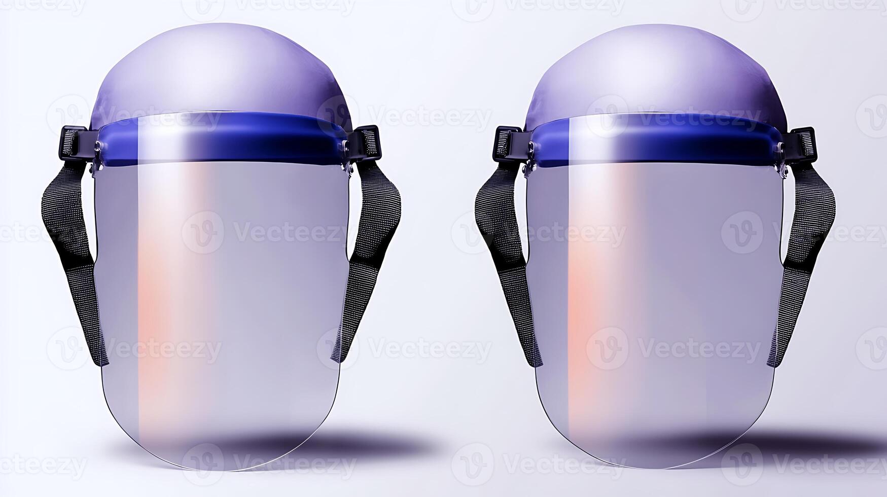 Two protective face shields displayed side by side against a minimalist background for safety equipment photo