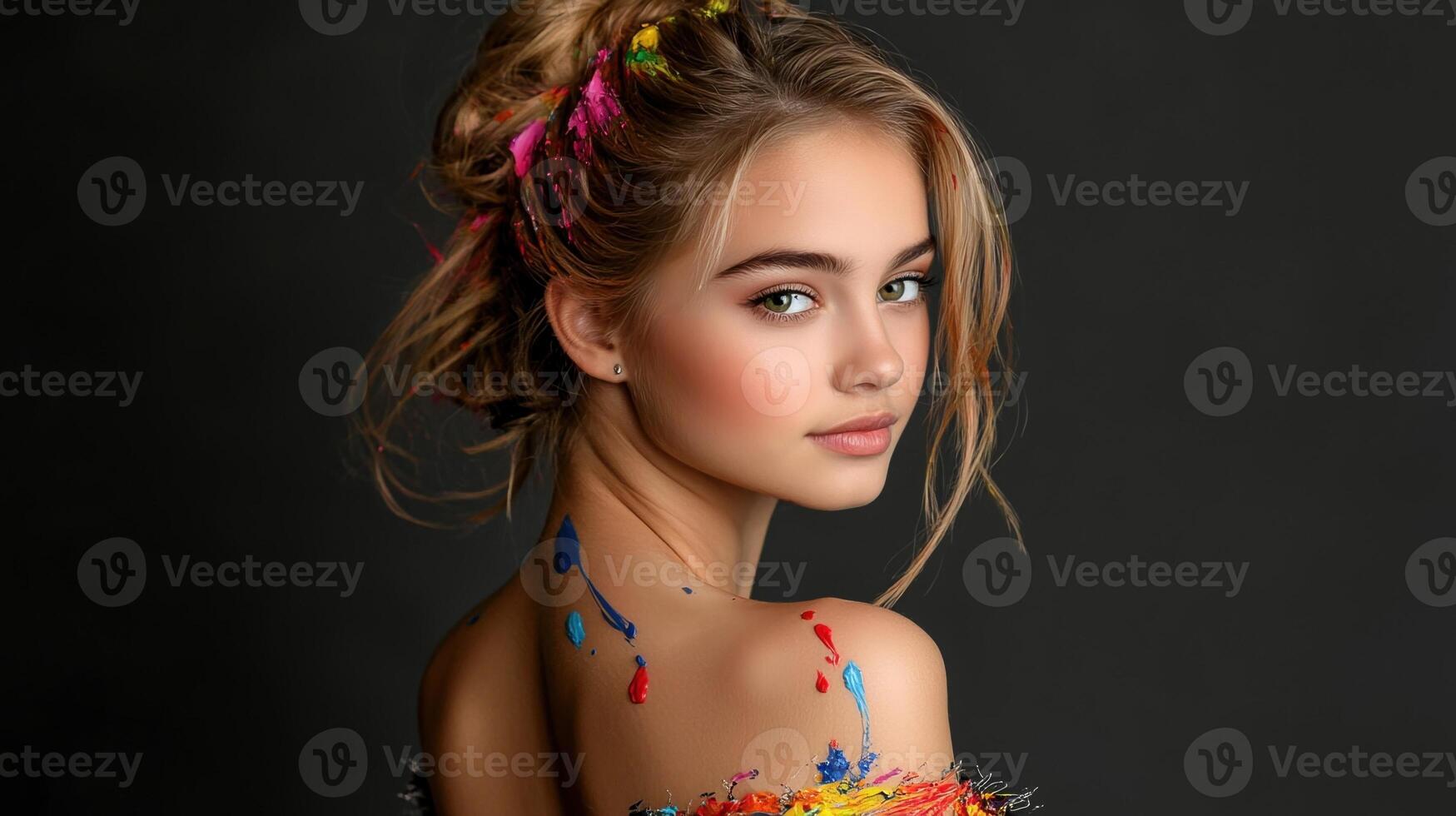 A young woman with colorful hair and a colorful back is posing for a photo