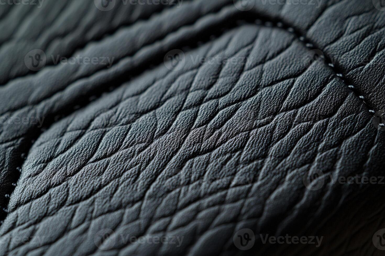This background features a soft-focus black leather texture with raised stitching, creating an elegant and subtle design ideal for branding and text overlay photo
