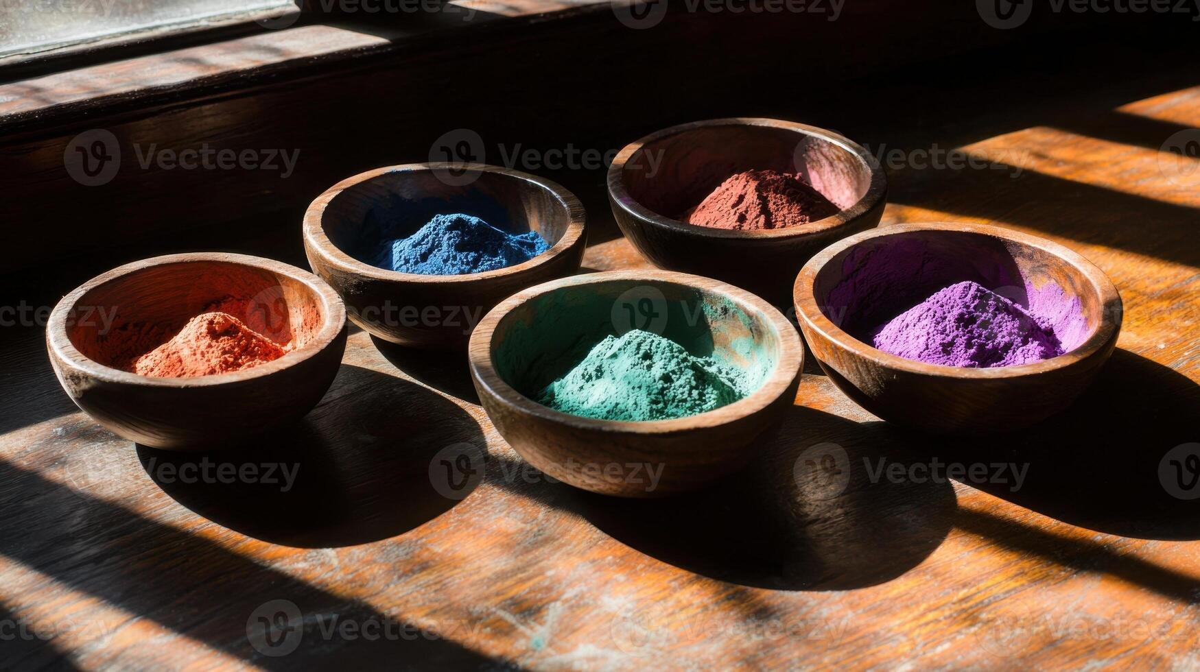 Colorful powders in bowls on a wooden table photo